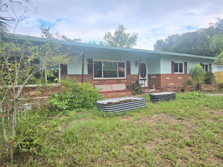 With Good Bones And Timeless Charm, This Home Is Ready For The Next Chapter In It's Own Story.  Inside, You'll Find A Spacious Living Room,  Refinished Wood Floors, A Renovated Kitchen Featuring Solid Wood Cabinets, Stainless Steel Appliances, A Dinette And An Inviting Family Room Filled With Natural Light. One Of The Bedrooms Has A Built-In Workstation Wraps Around Two Walls, And A Bathroom, Making It A Great Home Office. This 3-Bedroom, 2-Bath Home Offers A One-Car Garage With Washer, Dryer, Utility Sink, And A Shower (May Need Some Maintenance), A Basement/Storage Room, And An Added Bonus-A Covered Carport. Set On A 1/3-Acre Lot, The Backyard Offers Ample Space For Pets, Boat, RV, Or Other Toys, But Will Need Some Landscaping Attention To Truly Shine — A Great Opportunity To Create Your Own Outdoor Oasis. Roof (2012), HVAC (2014), Thermal Pane Windows (2021), Located Just Minutes From Charming Downtown DeLand And Stetson University, This Property Combines Solid Construction, A Great Location, And Endless Potential. Don’t Miss Your Chance To Make It Your Own! Call To Schedule Your Tour Today!