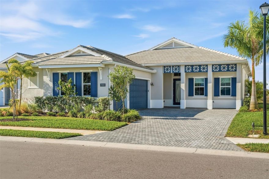 Welcome to this like-new Avery floor plan by Toll Brothers, offering 3 bedrooms, 3.5 bathrooms, and a side-load 3-car garage—priced below appraised value. Flooded with natural light, the home features dramatic ceiling heights, light oak engineered hardwood flooring throughout, and impact windows, creating a bright, calm, coastal-inspired aesthetic.

The heart of the home is the gourmet kitchen, showcasing a stunning waterfall quartz island, gas cooktop, JennAir appliances, and double-stacked cabinetry. The kitchen seamlessly opens to the living and dining areas, highlighted by expansive glass sliders that open up to truly enjoy indoor-outdoor living. Step outside to a heated saltwater pool and spa with upgraded tile and decking, surrounded by tropical landscaping and serene, expansive preserve views—an ideal backdrop for relaxing or entertaining.

The primary bedroom is a private retreat, featuring large windows overlooking the peaceful preserve and pool. Soft shadows from the surrounding areca palms filter through the windows, creating a calm, zen-like atmosphere. The spacious primary suite also offers a large walk-in closet with custom built-ins, providing both function and luxury.

Outside of the home, a classic Colonial elevation offers timeless design paired with coastal-inspired colors. A paver driveway leads to a side-load three-car garage, while tropical landscaping enhances curb appeal and privacy.

Located in The Isles at Lakewood Ranch, residents enjoy luxury living with resort-style amenities including a clubhouse, fitness center, resort-inspired pool, sports courts, scenic boardwalks, and walking trails woven throughout the community, offering an active yet serene Florida lifestyle. This exceptional home offers the best of Florida living in a prime location—don’t miss this opportunity.