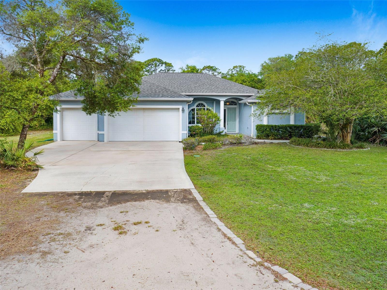 "Serenity Now" Custom Pool Home on 1.8 Acres with Theater, Privacy & Room to Expand! Enjoy the perfect blend of privacy, convenience, and thoughtful design in this custom-built home situated on 1.8 serene acres just 1 mile from the 407 for easy access to major highways and close to the Space Center. From the moment you enter, you’ll be greeted by soaring ceilings, tall windows, and wide open spaces that fill the home with natural light. The open-concept layout includes a spacious family room and a chef’s kitchen with granite countertops, a cooktop, built-in oven and microwave, breakfast bar, ample cabinetry, and a pantry. A large laundry room just off the kitchen includes an oversized walk-in pantry for even more storage.The split bedroom layout provides a private primary suite featuring his and her walk-in closets, an ensuite bath with deep soaker tub, separate shower, water closet, and a flex space that opens directly to the screened pool patio making it perfect for a home gym, office, or nursery. A standout feature of this home is the grand theater room, purpose built for an immersive experience with poured concrete walls for soundproofing, extensive conduit wiring beneath the floors for customizable audio configurations, blackout drapes, theater lighting, and a built-in projector and screen. This space can also be easily converted into a separate guest suite or in-law quarters, thanks to a full bathroom with private access to the pool area and the ability to close it off from the rest of the home. Enjoy peace of mind with accordion hurricane shutters and a brand new roof. Whether you're hosting, relaxing, or working from home, this property offers unmatched flexibility and comfort. Don’t miss your chance to experience “Serenity Now” This is one you truly have to see to believe!