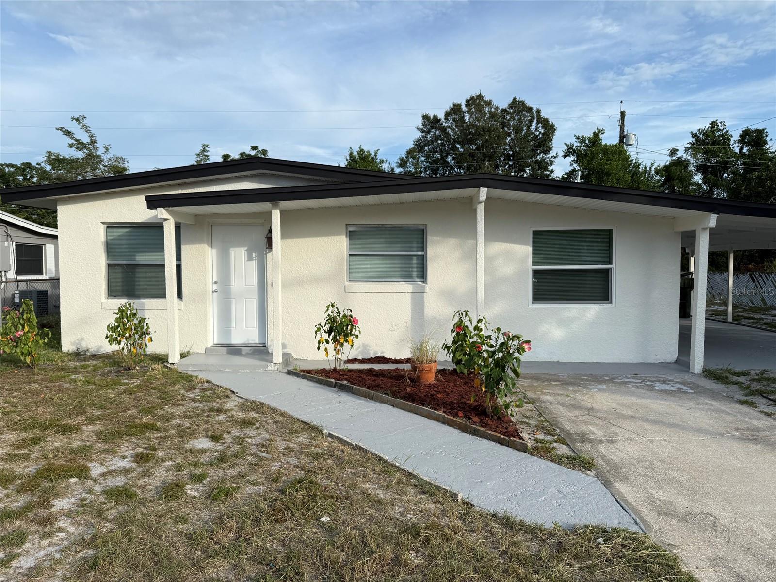 Welcome home, newly updated 3 bedroom 2 bathroom home situated in the heart of Ocoee. Inside enjoy an open layout showcasing a spacious living room, dining room, and kitchen fitted with white shaker cabinets, stainless steel appliances, and Quartz countertops. A split bedroom layout, along with newly remodeled bathrooms featuring marble look tile and new fixtures. Outside, enjoy a spacious yard and accessory storage building. Nestled on a large lot within minutes to nearby shopping, restaurants, and convenience.