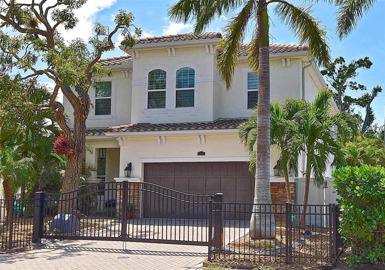 **Motivated Seller** 2015 magnificently updated home located WEST OF THE TRAIL 5 bedroom/3.5 bathroom plus office.. This gated residence is ready for you to move in. As you enter you will be greeted with beautiful porcelain large format tiles throughout the bright open first floor plan with 10-foot ceilings. You will find Florida living at its best with large sliders connecting the screened pool patio area to the modern family room inclusive of a large TV wall with a linear fireplace. The beautiful kitchen area offers an oversized waterfall natural quartzite counter with a Monogram induction cooktop, a wine cooler and a walk-in pantry. Enjoy the outdoor area with the heated pool/spa under a twinkle light cage and built in gas grill. The layout makes entertaining a breeze. Downstairs you will also find an office and laundry room.
Upstairs you will encounter a spacious primary bedroom with tray ceilings that was designed with his & hers closets and en-suite bathroom including a tub & shower as well as a double sink sizable vanity. An oversized guest bedroom upstairs can be used as a second family room, exercise room or playroom. All the bedrooms have beautiful wood floors. The
landscaping has been thoughtfully designed for ultra-low maintenance and ensuring minimal care.
Whether it’s your primary or secondary home, this property offers plenty of room for the entire family in a wonderful neighborhood with top rated schools. Take a short one block stroll to Southside Village to grab a bite, do some shopping or enjoy neighbors' night out events. Downtown Saturday Farmers Market, Siesta Key and Selby Gardens are conveniently located a short drive away.