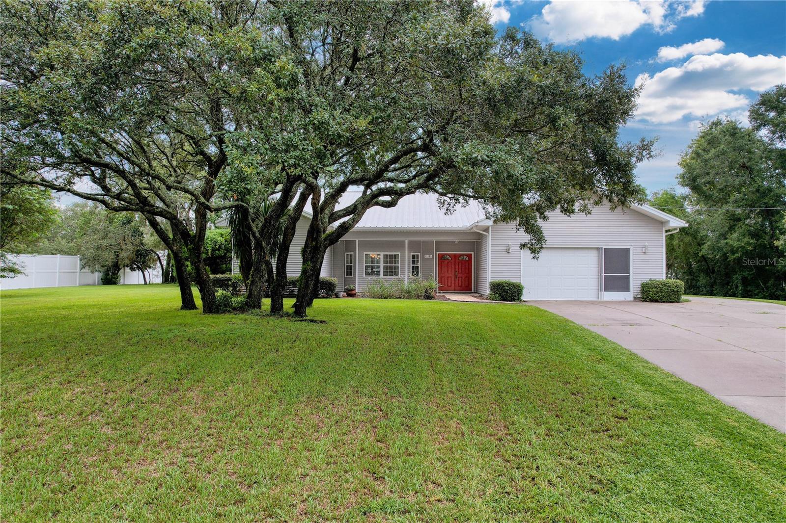 Custom Steel Frame Home with Saltwater Pool & Detached Garage on Over an Acre!
Discover the ideal combination of strength, style, and space in this custom-built steel frame home, featuring a durable metal roof and metal siding for long-lasting performance and low maintenance. Situated on over an acre of beautifully mature landscaping, this property offers exceptional privacy and freedom with no HOA and no CDD.
Inside, the home features a well-designed layout with three spacious bedrooms and two full bathrooms, a large great room, family room, and a formal dining room—perfect for entertaining or relaxing. The kitchen includes an eat-in area, creating a warm, inviting space for daily living.
Step outside to your own private retreat: a screen-enclosed saltwater pool with paver decking, surrounded by lush greenery.
Adding even more value is the detached 2-car garage with a workshop, offering plenty of space for vehicles, tools, hobbies, or additional storage—perfect for anyone who needs extra room to work or play.
Built for comfort and longevity, this home is a rare find that offers room to breathe and space to thrive—inside and out.
Convenient to shopping, restaurants, medical care, Suncoast Parkway and Tampa.