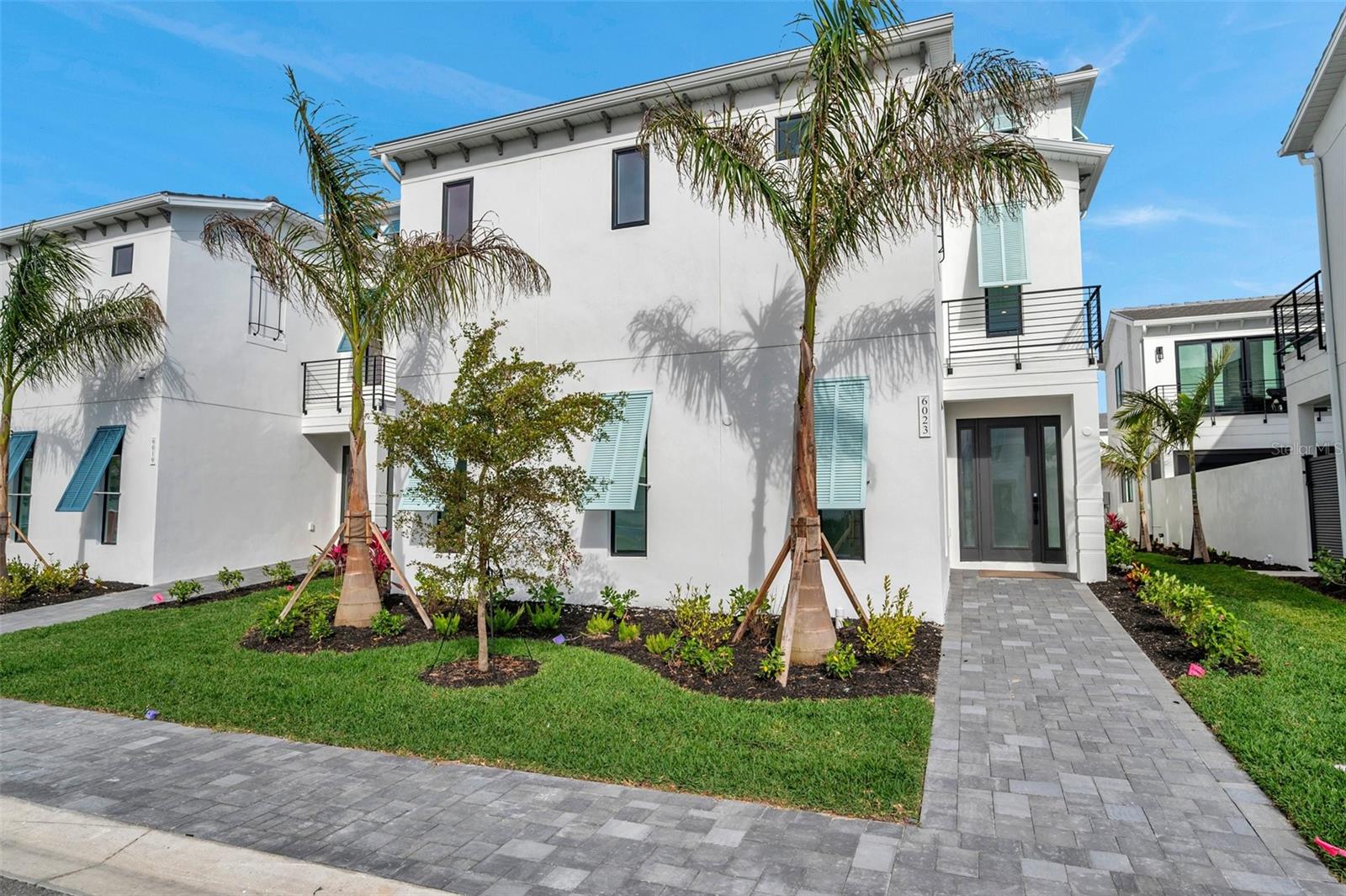 Brand New 2025-Built Salt Meadow Two-Story Residence on a Premium Lot, Steps Away from Aqua’s 4-Acre Blue Lagoon. This exquisite Salt Meadow two-story residence offers exclusive access to Aqua’s 4-acre translucent blue lagoon and tropical beach, featuring world-class amenities. The sparkling lagoon and soft sandy shore provide an idyllic setting for swimming or relaxing with family and friends while enjoying the bay breeze and Florida sun. Boasting over 4,000 square feet of meticulously designed living space, this home comprises four spacious bedrooms and four luxurious bathrooms. Notable Features Include: Expansive open floor plan enhanced by abundant natural light; Gourmet kitchen with custom Serenity Kraft Maid cabinetry, quartz countertops, a large island, and a premium LG Signature Range featuring gas, induction, and sous vide capabilities; Private courtyard oasis with heated pool, waterfall feature, and lanai prepared for an outdoor kitchen; Elegant primary suite with walk-in closet, private balcony, and spa-inspired bathroom featuring soaking tub and frameless rain shower; Walk-in closets in all bedrooms with en-suite or adjacent bathrooms; Convenient second-floor laundry room and two-car garage; Elevator prep. ready; Located in one of Florida’s most sought-after non-flood zones, Aqua offers convenient access to IMG Academy, world-class golf courses, the beaches of Bradenton and Anna Maria Island, Sarasota Bay, SRQ Airport, and the University Town Center Mall.