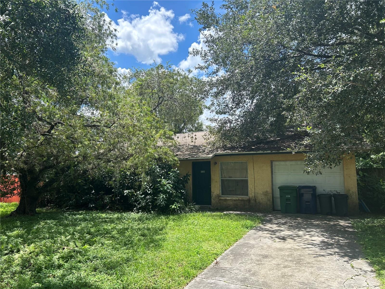 This 3-bedroom, 2-bathroom block home in the Terrace Park neighborhood offers a fantastic opportunity to create your dream home or presents a fantastic rental opportunity. With 1,420 square feet of living space and a functional layout, this property provides the perfect canvass. The living room features a fireplace, and the primary bedroom has a private bath and sliding door access to the back yard. Additional features include an attached garage and a screened-in lanai. Bring your vision and tools to restore this home to its full potential. Located with easy access to shopping, dining, and major roadways. This property is being sold "as is" and is an ideal investment for those ready to tackle a renovation project.