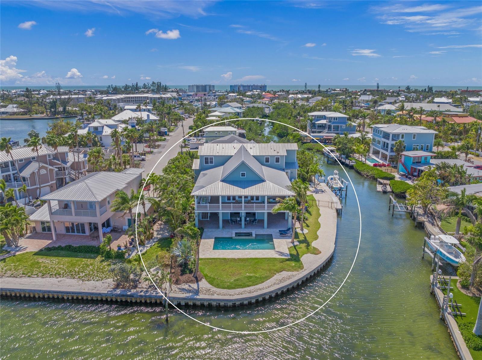 Introducing a truly exceptional bayfront estate on Anna Maria Island, masterfully designed by renowned architect Gene Aubrey. This 5-bedroom, 5-bath coastal masterpiece—with additional office, second living area, and gym—blends timeless architecture with state-of-the-art amenities, all set on an expansive 225 feet of serene bay frontage in Holmes Beach.
Every detail of this residence reflects thoughtful design and superior craftsmanship. The home features a standing seam metal roof, rich maple floors throughout, Anderson impact windows, new A/C units, and an elevator for effortless access across all levels. The chef’s kitchen is outfitted with Subzero refrigeration, Wolf appliances, a beverage cooler, and custom cabinetry—perfect for both everyday living and elegant entertaining.
Enjoy whole-home wired audio and security systems, a spacious main-level gym with new epoxy flooring, and a second living area offering flexible lifestyle options. Outdoors, lush updated landscaping with professional lighting surrounds a sparkling pool with all-new equipment, including heater, pumps, and chlorinator. Relax on the synthetic deck, protected by a mosquito control system, while taking in unobstructed bay views.
Boaters will appreciate the brand-new seawall and 10,000 lb boat lift, along with a rainwater cistern-fed irrigation system for sustainable living. The oversized garage also features new epoxy flooring.
This one-of-a-kind waterfront estate is a rare opportunity to own a Gene Aubrey-designed home that effortlessly combines sophistication, functionality, and island luxury.