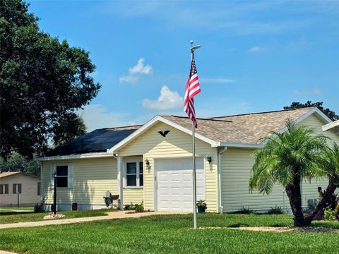 Photo of 1223 Tarpon Lane, Lady Lake, FL 32159 (MLS # OM731443)