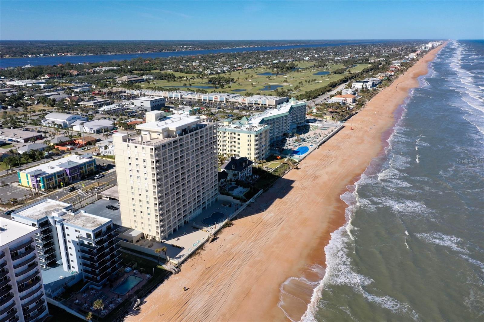 One or more photo(s) has been virtually staged. Direct Oceanfront Living at Its Best at 89 Oceanfront! Wake up to the sound of the waves and endless ocean views at this beautifully updated 2-bedroom, 2-bath condo located directly on the beach in Ormond Beach. Situated on the second floor, this residence offers the rare convenience of parking right at your door—no stairs or elevators needed. Simply unload your groceries and step into paradise. Inside, you’ll find a light and airy beachside retreat with neutral tones, white cabinetry, newer flooring, and a fresh coastal vibe throughout. The open living room flows seamlessly onto a private balcony where you can soak in the stunning Atlantic views all day long. Both bedrooms are generously sized, and the bathrooms are en suite, clean and bright—perfect for full-time living, a vacation escape, or a smart investment property. With direct access to the sand and surf just steps away, and all the charm of Ormond’s infamous food and fun vibe close by, this is Florida coastal living made easy. Don’t miss your chance to own a slice of oceanfront heaven!