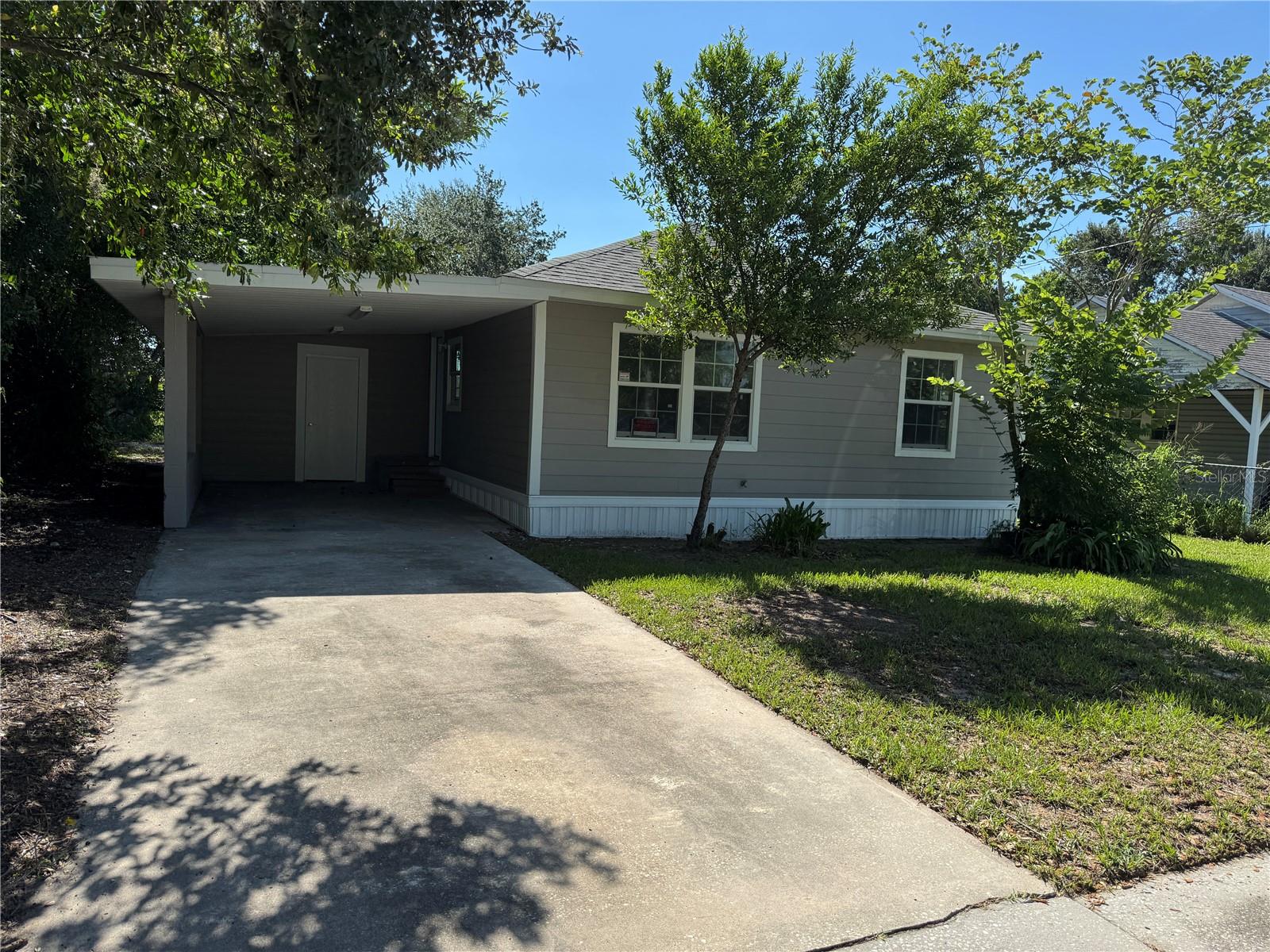 Welcome to this beautifully updated 2-bedroom, 1-bathroom home in desirable Auburndale, FL! Though compact at 672 sq ft, this home is huge on possibilities and style. Step inside to an open floor plan with high ceilings that create a bright, airy feel. The modern kitchen features granite countertops, stainless steel appliances, and plenty of workspace—perfect for cooking and entertaining. A separate laundry room adds convenience, while the covered carport keeps your vehicle protected year-round. Enjoy the spacious private backyard—ideal for relaxing, gardening, or future expansion. This home delivers comfort, function, and opportunity. Located just minutes from major freeways, shopping, and schools, this move-in-ready gem offers the best of small-home living with room to grow. Schedule a private tour today! Apply here: https://apply.link/WzcS2tc