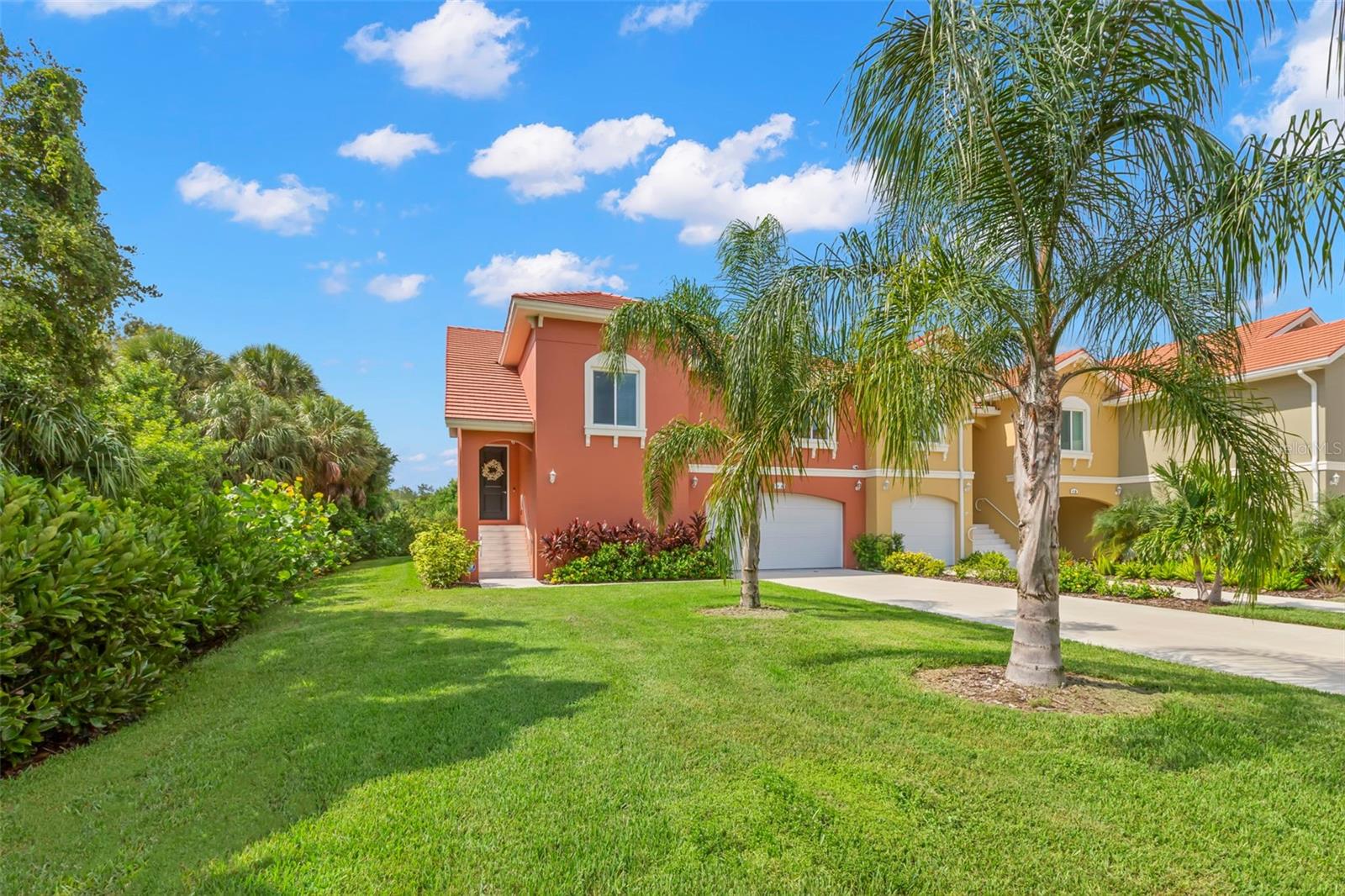 This fabulous designer-styled home offers the ideal blend of pure luxury and practical convenience and includes a 32' boat slip with a new 10K lift! From the moment you enter this nearly new Villa you will enjoy the open floor plan and thoughtful layout; all overlooking the lagoon and preserve beyond. Featuring a calm, neutral color palette with dramatic accents that enhance the beautiful water views, all amid the quiet serenity of Marina Bay. With the most private lot and the longest driveway (125') in all of Marina Bay, this beautifully appointed home is loaded with upgrades including a custom Pergola on the upper terrace creating a large, covered lanai for endless outdoor enjoyment. Deluxe Kitchen cabinets, luxury series Cambria counter tops, premium lighting throughout with ceiling fans, and a fully equipped Smart Home infrastructure with built-in speakers and low voltage systems included, along with the Control 4 rack, equipment, and four nearly-new TV's. Custom closets in the Owner's Suite and custom window treatments throughout the entire home including Hunter Douglas motorized solar window shades in Owner's Suite and Great Room sliding doors; custom blinds on all other windows. Additional premium features and thoughtful finishes in this 3 bedroom, 2 bath Villa include 10’ ceilings with dramatic vaults in the Great Room, tray ceilings in the Owner’s Suite, deluxe Thermador appliance suite including a 5-burner natural gas cooktop with vented chimney wall hood, Masterpiece combo speed oven and oversized 84" refrigerator, huge walk-in pantry (9' x 5'), and natural gas tankless water heater for endless hot water. All concrete construction with impact doors and windows for extra protection, and a 22kW GENERAC Natural GAS GENERATOR for ultimate peace of mind. This unique 2,574 sq ft home has ALL LIVING SPACE ON ONE LEVEL with a deluxe private elevator from the enormous first-level garage below providing a garage beyond compare! Marina Bay is located next to Eckerd College on the southern tip of Pinellas County, just minutes to downtown St. Petersburg, moments to world-class beaches and only 25 minutes to Tampa airport. This gated, waterfront community features almost 2,000’ of intracoastal water (ICW) directly on Boca Ciega Bay and a beautiful marina with three deep-water day slips and a community fishing pier. Additional community amenities include 2 pools (one with geothermal heat for year-round swimming), 2 spas, fitness room, clubhouse, direct access to the Pinellas Bike Trail, spectacular water features and fountains, mature tropical landscaping with an abundance of wildlife, pet friendly and endless opportunities to enjoy the Florida lifestyle. Don’t miss this exciting opportunity to own a nearly-new luxury villa in the breathtaking Marina Bay community!