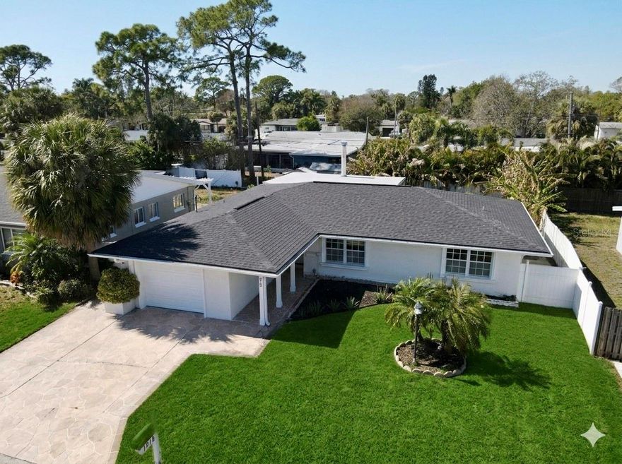 One or more photo(s) has been virtually staged. This beautifully reimagined 3-bedroom, 2-bathroom residence offers a fresh take on Florida living in the coveted Shore Acres community of St. Petersburg. Every inch of this home has been meticulously updated, balancing modern aesthetic with structural peace of mind.

Modern Interior & Open Layout
The heart of the home features an open-concept design that seamlessly connects the living and dining areas to a chef-inspired kitchen. Highlights include:

Contemporary Finishes: New luxury vinyl plank and tile flooring throughout (no carpet).

Designer Kitchen: Features crisp white cabinetry, premium quartz countertops, and a full suite of stainless steel appliances, including a high-tech see-through refrigerator.

Cozy Focal Point: A stunningly tiled wood-burning fireplace serves as the centerpiece of the spacious living room.

Outdoor Living & Key Upgrades
Step through to a generously sized, fully fenced backyard featuring professional new landscaping and an automatic irrigation system. You can move in with total confidence knowing the "big ticket" items are already handled:

Roof: 2021

HVAC: 2019

Water Heater: 2020

Fresh Paint: Brand new interior and exterior coats.
The house is equipped with automatic lawn irrigation.

The Shore Acres Lifestyle
Located in a golf cart-friendly neighborhood with no HOA or CDD fees, you are perfectly positioned to enjoy the best of St. Pete:

Recreation: Minutes from the new Shore Acres community center, pool, pickleball courts, and playgrounds.

Location: Easy access to top-rated schools, vibrant Downtown St. Pete, and world-class Gulf Coast beaches.

Convenience: Includes an indoor laundry room (washer/dryer included) and quick routes to local dining and shopping.

Pro Tip: Shore Acres is known for its active community vibe. Be sure to check out the local golf cart parades and the newly renovated recreation center just down the street!