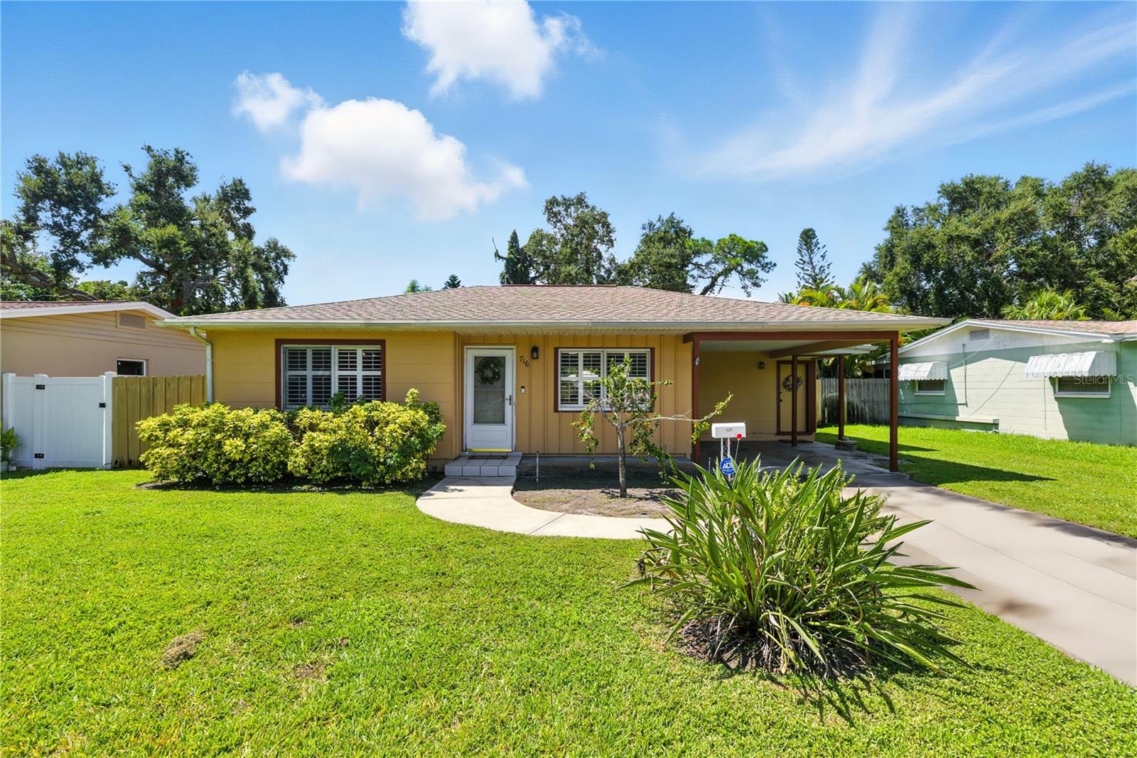 Welcome to this updated 2-bedroom, 1-bath home located in the desirable Greater Pinellas Point area of St. Petersburg. Step inside through the screened front door into a welcoming open living space with plantation shutters throughout. Both bedrooms and the bathroom are situated on the east side of the home, while the kitchen and dining room overlook the screened patio and open slab, offering a nice connection to the fenced backyard and landscaped outdoor space.
The kitchen and bath were updated in 2024, and major systems are already taken care of with a roof (2021), HVAC (2020), and water heater (2025). The laundry is just off the kitchen and provides direct access to the covered carport, keeping you out of the rain. Additional features include laminate floors throughout, and a screened porch.
This home had no damage from the 2024 hurricanes. The neighborhood is known for its quiet streets, unique pink concrete roads, mid-century “birdcage” homes, and convenient access to over 140 acres of nearby parks, downtown St. Petersburg, the Skyway Bridge, and area beaches.