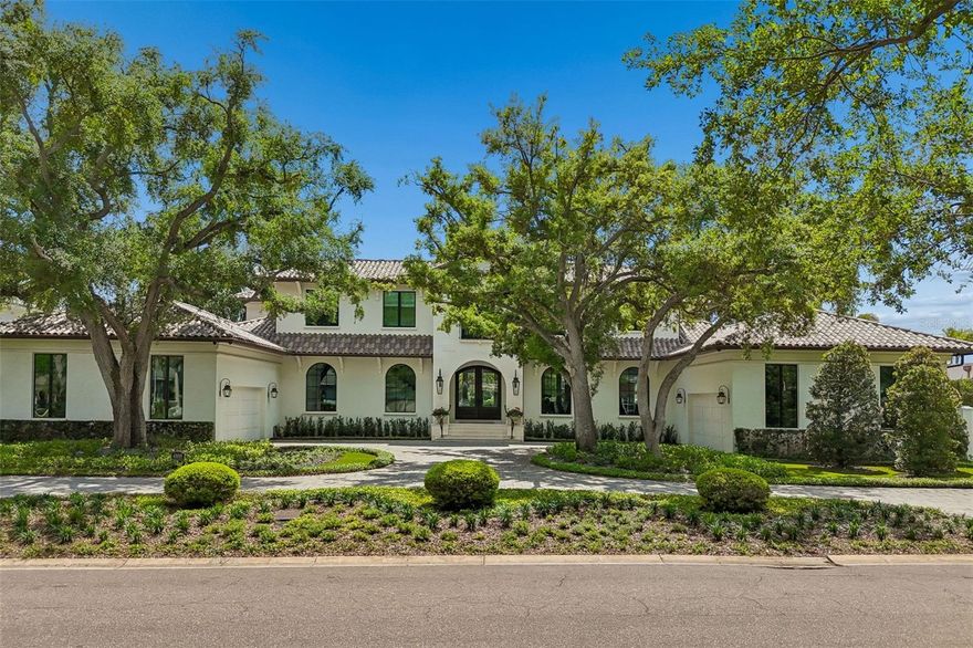 Modern luxury meets the best of waterfront living in this Modern Mediterranean inspired architectural masterpiece.  Set on this 145' deep  x 149' wide lot on the Grand Canal of Culbreath Isles, Tampa's top guarded and gated community and built in 2016 by Soleil with the best of everything that money and good taste can buy, this 6537 sf residence features two 2 car garages, a custom 950 pound capacity elevator, 5 bedrooms plus office plus 2 laundry rooms, elegant dining room, plus a fantasy style club room with 5 tvs and a bar inspired by the Hotel Monteleone in New Orleans.  This area could serve as a future first floor master suite.  The kitchen is a chef's dream with Wolf 6 burner gas range, Bosch dishwasher, and SubZero refrigerator.  The primary bedroom has 2 exquisite walk in closets and a balcony overlooking the water.  Outdoor's  enjoy the spectacular 36 x 14 resort style saltwater pool and spa, a fully equipped grill area ideal for entertaining, wood burning fireplace with propane plumbed for easy starting, and a Samsung 65" Smart tv.  The 4 car garage areas have 14.6 foot ceilings to allow installation of a 4 post car lift.  The east dock can house up to major super size yachts.  Culbreath Isles is located minutes to Tampa's top public and private schools, world class shopping and dining, Westshore Business District and downtown Tampa, Tampa International Airport, and the nation's top rated beaches.