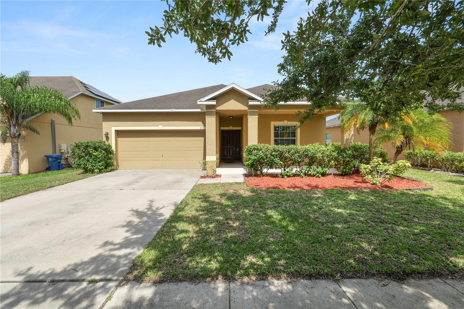 Live the Florida Life here in this Charming 3-Bedroom 2 BATH Home with a large covered front porch to welcome your guests while offering a great spot to sip morning coffee. Ready for immediate occupancy and can close quickly! Located in a desirable community, just a short drive from world-famous Disney Orlando attractions! With the interior living space, this home combines modern features with cozy charm. Step inside to tour the upgrades and you will love the BRAND NEW LUXURY VINYL PLANK flooring throughout the main living areas, creating a stylish and low-maintenance environment. The spacious open layout flows seamlessly from the living room into the dining area and kitchen, perfect for entertaining. The heart of the home is the kitchen that gleams with granite countertops, island seating, and ample cabinet space-perfect for creating everyday meals! Florida living year-round on your large screened-in back patio, take in the breeze while overlooking a fenced backyard — an ideal space for relaxing and grilling! Whether you're looking for a primary residence, vacation home, or investment property, this move-in-ready gem checks all the boxes. Community playground and within easy reach of local shopping, dining, theme parks/attractions, medical centers and the airport. Schedule your private showing today!