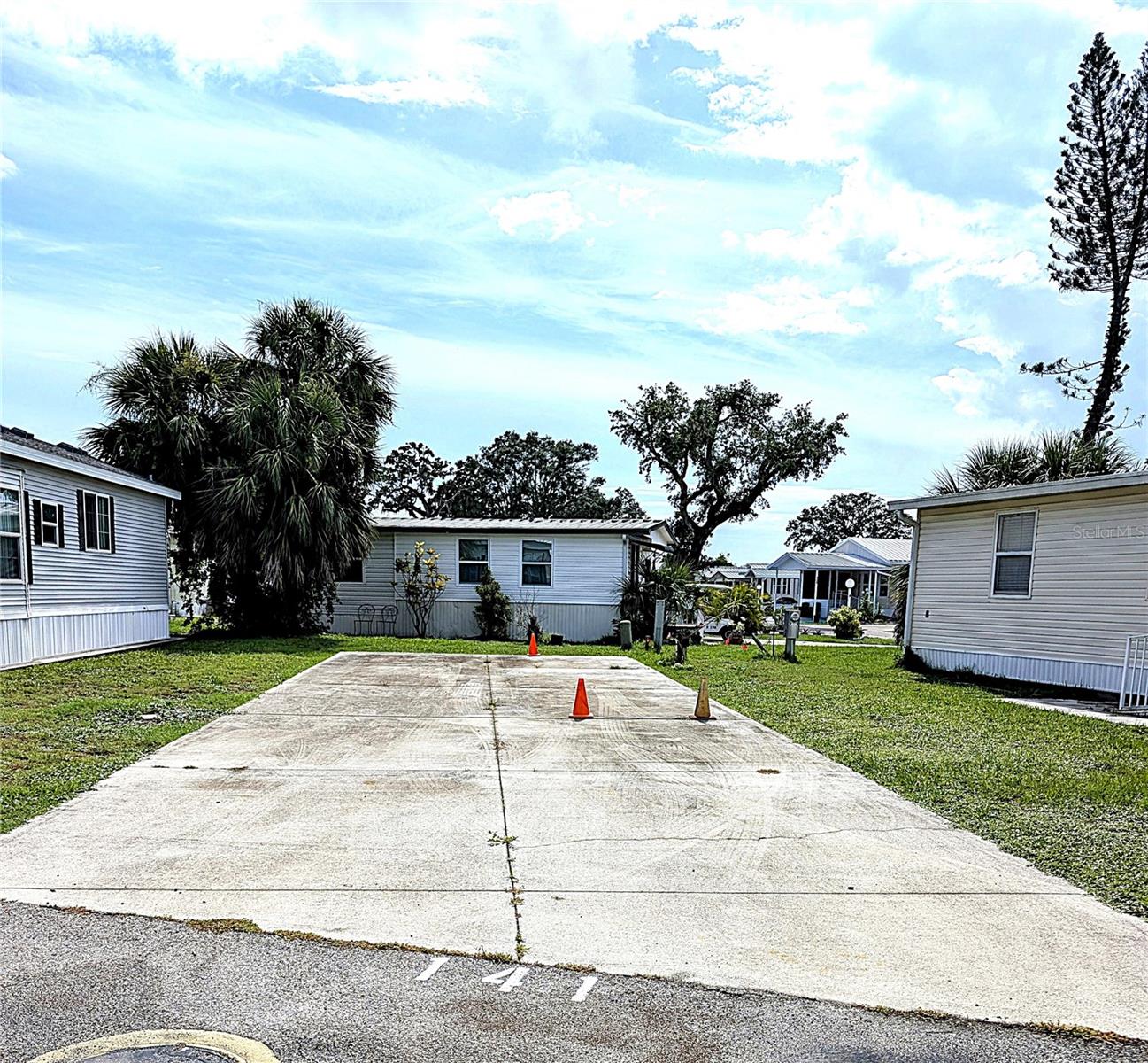 This site is RV ready! A cement pad is already there for easy parking. Water and electric hook ups are already on site. Right across from the large heated community pool and clubhouse. Sugar Creek Estates is a 55+ community. Featuring, not only a pool and the clubhouse, but shuffleboard courts as well. The community does require a background check and minimum credit score of 750 to purchase. Come check out this beautiful park for yourself!