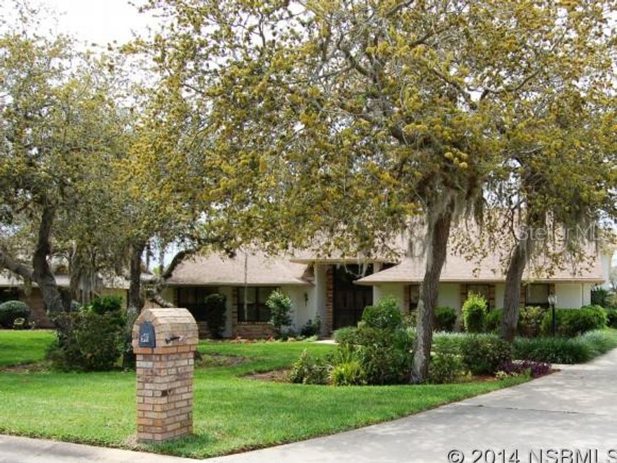 3 bed 2.5 bath Sugar Mill home- Spacious and open floor plan, large raw stone fireplace, formal dining and eat-in kitchen. Custom wet bar with beer tap, ice maker and seating for 8!  Great room is perfect for game/media space or family room. Tile sitting room w/ indoor vented Viking grill! Screened in patio overlooking vegetable/herb garden with irrigation. Beyond the garden, peaceful views of Florida pines, palms & osprey. Mature landscaping in the front yard, and rear entry 3 car garage has plenty of room for toys or a golf cart. Highly desirable area of Sugar Mill Country Club. Full service  club with gorgeous clubhouse, dining, pool and fitness amenities and a challenging 27-hole championship golf course. Easy access to I-95, minutes to the beach, and an hour from Orlando. ;Water: City