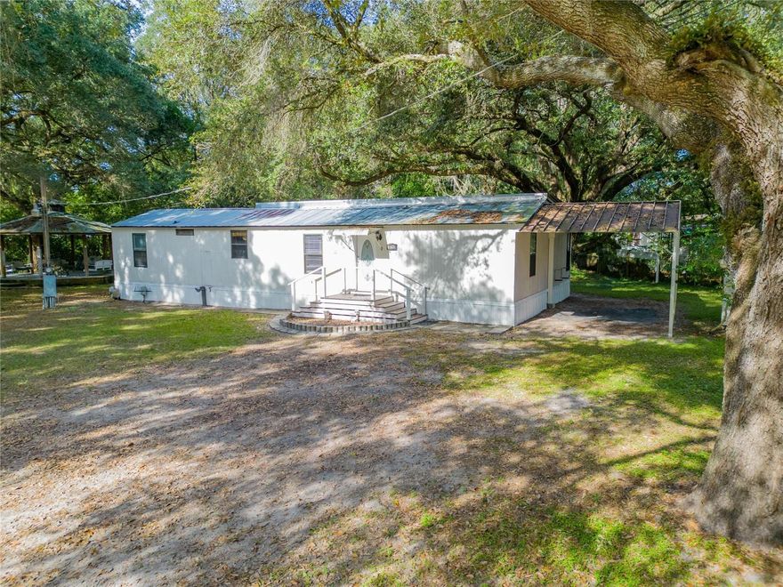 DO NOT MISS THIS OPPORTUNITY!!!  This is a comfortable 4 bedroom/3 bathroom private home on a one acre lot with mature oaks.  Conveniently located between Tampa, Brandon and Lakeland.  Easy access to I-75 and I-4 and just a few minutes from I-275. The property also has two separate septic tanks, shared deep well, and electric on a saw pole, which makes it a perfect lot for a new home or possible rental income. The property sits off of the main road which gives it a private feel while being close to the city.  This home is located just minutes away from the MIDFLORIDA Credit Union Amphitheater and the Hard Rock Hotel & Casino and approximately 20 minutes away from Downtown Tampa, Tampa International Airport, Wesley Chapel, Brandon and just one hour away from Disney!