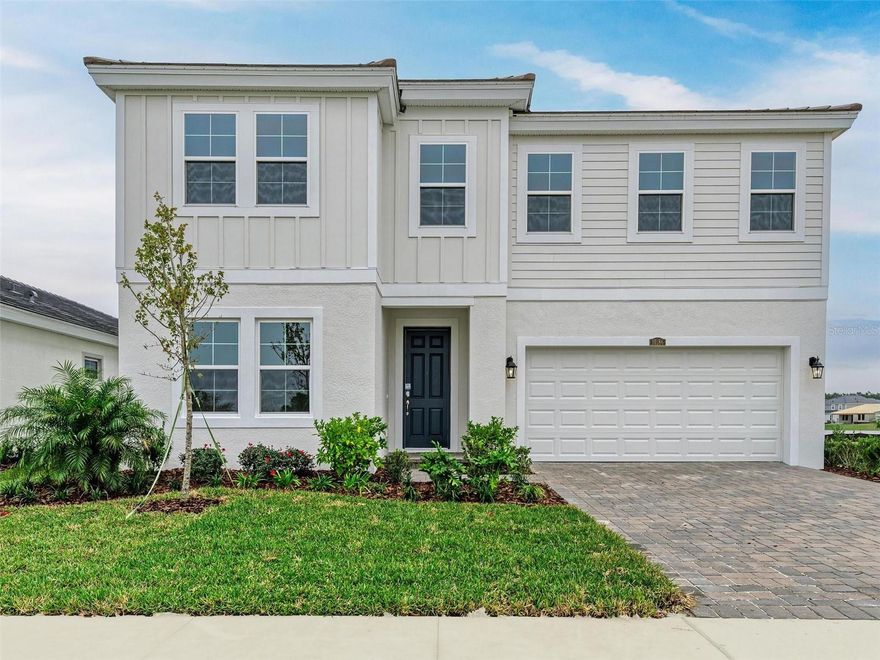 One or more photo(s) has been virtually staged. This Pelican is ready for move-in! This home showcases appealing finishes, including Sonoma Duraform Wood style cabinets, pristine Frost Whte MSI Quartz countertops, and durable Polaris Plus luxury vinyl plank flooring throughout the main areas. The Pelican is a generously sized and adaptable design, providing 3,381 square feet of thoughtfully planned living space. This expansive floorplan incorporates five bedrooms, three bathrooms, and a two car garage. The open concept layout ensures a seamless connection between the primary living spaces, achieving an ideal mix of comfort and practicality. Residents can enjoy a covered lanai providing beautiful views over the water. This design is further enhanced by a gourmet kitchen package and a convenient guest suite located on the first floor. The second story hosts the spacious owner's retreat, the laundry room, and the remaining secondary bedrooms. 
Listing Price amount for this Pending Sale includes Design and Structural Options.