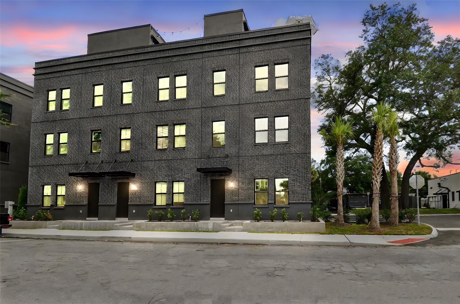 Under Construction. Move-in ready homes are available now! Step into the heartbeat of Tampa’s most electric neighborhood with Canvas City Homes GWX, a limited collection of industrial-chic city homes inspired by the bold spirit of Ybor City. This is where historic brick cigar factories meet modern design, where art, culture, and nightlife collide just outside your door. From the street-level entry to your private rooftop terrace with city skyline views, every detail is designed for life in motion. Inside, 10-foot ceilings, exposed block walls, and bright sunlit spaces create the perfect backdrop for your personal style. The ground floor sets the tone with polished concrete floors and a sleek ensuite bedroom. Upstairs, the massive kitchen island takes center stage, made for dinner parties, cocktails with friends, or Sunday morning brunch. On the top floor, the primary suite delivers main-character energy with double walk-in closets ready for your best fits. Step outside, and you’re minutes from Ybor’s buzzing restaurants, bars, and art studios, or hop on the streetcar to explore Downtown, Channelside, or Sparkman Wharf. With the transformative Gas Worx development rising just steps away, this neighborhood is only getting hotter, and Canvas GWX puts you in the front row. Whether you’re looking for a primary residence or investment property, Canvas GWX puts you ahead of the curve in one of Tampa's fastest-growing neighborhoods. Secure your spot today and call Canvas GWX home in the city’s most vibrant district. Move-in ready homes are available now, with limited-time buyer incentives.