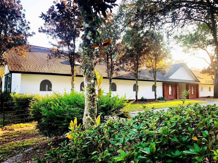 This 33 + acre farm features one of the most beautiful elevations in all of Marion County! Bring your horses and cows! Are you dreaming of a life surrounded by nature, luxury, and top-tier equestrian facilities? Imagine waking up to the serene sounds of sandhill cranes and the sight of rolling hills adorned with numerous majestic oak trees providing a tranquil canvas for your equestrian dream farm. Silverleaf Hills, a newly developed, gated community spanning over 768+ acres of breathtaking beauty and next door to Kentucky Derby wining training center McPeek Racing. Nestled in the heart of the community with  amazing picturesque views and premier building sites designed for efficiency and elegance. First-Class Construction: This farm was built with commercial quality infrastructure including roads with underground drainage systems around your primary parcel, ensuring durability and ease of management for your equine operations. Two Parcels totaling 33+ acres: 23.06 with 2 barns and 22 paddocks, covered walker and round pen, 10.06 broodmare pasture. "The Twins" - TWO Classic Kentucky style Block Center Aisle Barns with 22 12x12 stalls each for a total of 42 (2 double foaling stalls), newly equipped with LED lighting and have rubber mats and wooden lower walls. The barns mirror each other between a Magnolia lined viewing lane, Multiple tack rooms, a laundry room, office spaces, a break and feed rooms, 2 breeding stocks and storage rooms and each barn equipped with fly systems. The circle drive with unloading side ramp for all size and semi rigs easy access . Features 19 covered paddocks with oversized three sided shelters built with steel and on concrete/clay base, with 5 board and no climb fencing and auto waters, round pen and a 6-horse walker within a covered building. Oversized well and 50 amp RV hookup with its down dedicated septic. Bring your own builder and create the ultimate Equestrian masterpiece with spectacular primary sites along with several sites for guest houses and cottages. Nearby to Publix, Costco and dozens of restaurants! Additional parcels available to combine up to 73 + acres total!