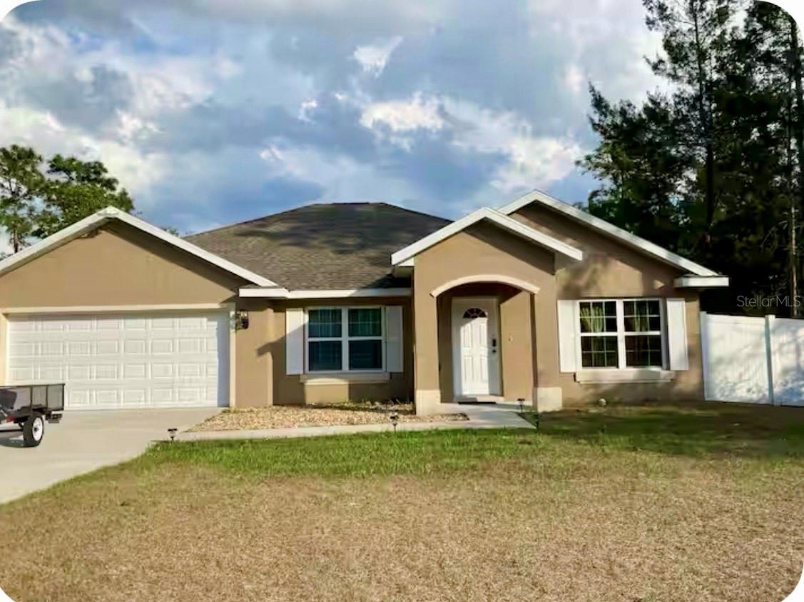Welcome home to this beautiful modern house in Ocala, where comfort meets style in an expansive 1,946 square feet of thoughtfully designed living space. This charming residence features three inviting bedrooms and two pristine bathrooms, offering ample room for both relaxation and functionality. A highlight of the home is the spacious kitchen, equipped with an abundance of cabinetry, sleek stainless steel appliances, and a generous pantry that caters to all your culinary needs. The large master bedroom is a true retreat, complete with sliding doors that open up to a fully-fenced backyard, ensuring privacy while you enjoy the outdoors. Additionally, there's a versatile bonus room perfect for a home office or play area.The garage has been transformed into a cozy efficiency unit that is fully upgraded and ready for comfortable living. This space features modern amenities, including a small kitchenette, a bathroom, and a comfortable sleeping area. The upgrades make it a stylish and functional place, with fresh paint, new flooring, and updated fixtures throughout. This efficiency unit can also be rented out for an additional fee.Conveniently located near shopping centers and restaurants, this home is also just a short 15-minute drive from the stunning Silver Spring National Park. Don’t miss the opportunity to see this property, call me today for a private showing!
