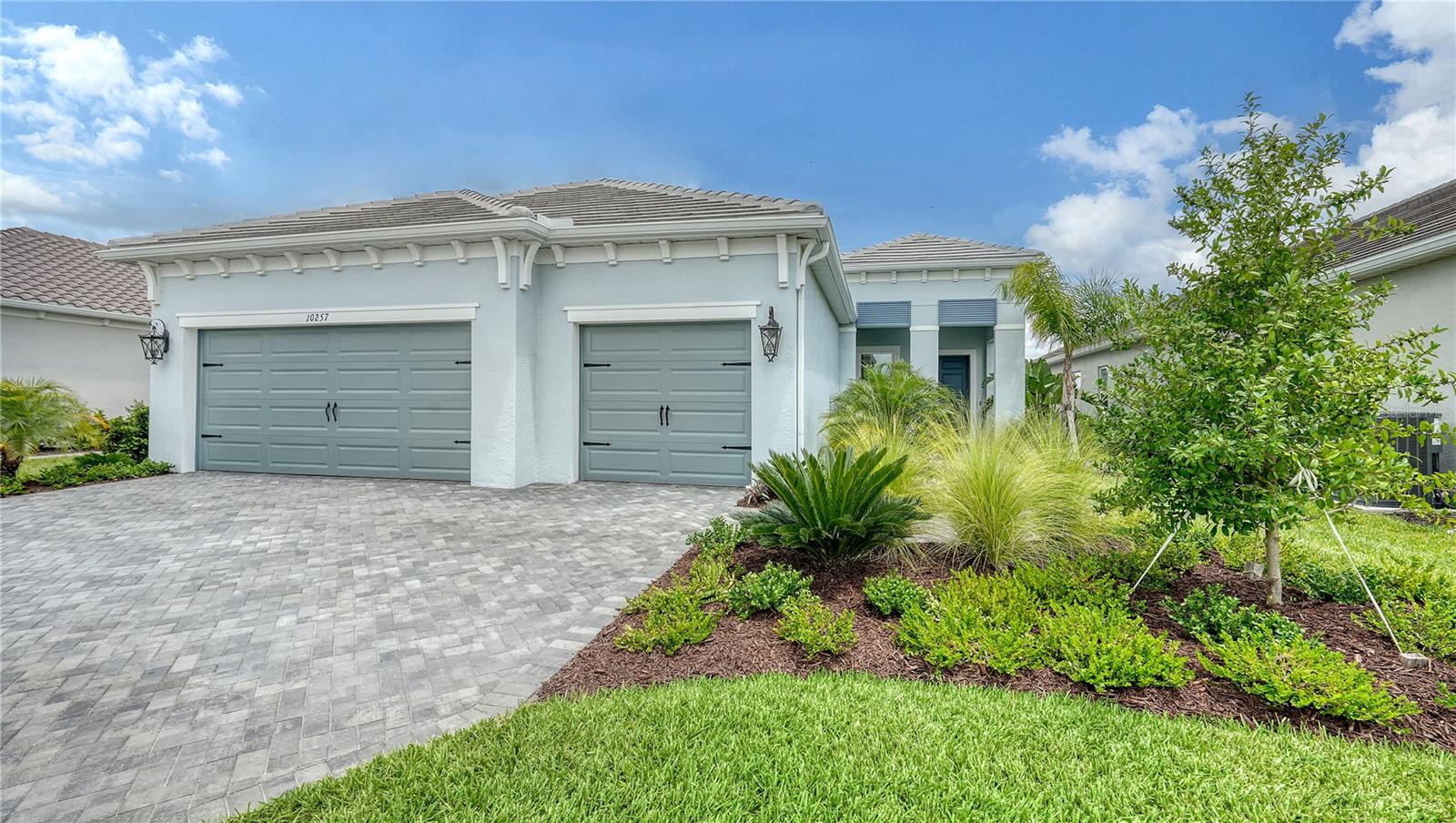 Professionally Upgraded Home with Expansive Lake Views in Grand Park – Over $285K in Enhancements
Welcome to 10257 Canaveral Circle, a luxury move-in ready showpiece in Sarasota’s coveted Grand Park community, built in 2023 by Neal Communities. Perched on an elevated lot with sweeping lake views, this elegant residence stands out with over $226,000 in builder upgrades and an additional $60,000+ in high-end post-closing enhancements, making this an extraordinary turnkey opportunity.
Inside, you're greeted by wood-look tile flooring throughout and a bright, open layout anchored by designer-appointed finishes from Restoration Hardware, including custom lighting in the kitchen, great room, and all bathrooms. The gourmet kitchen features a five-burner gas cooktop with wall ovens, upgraded hardware, and pendant lighting—perfect for entertaining.
Enjoy the saltwater pool and spa, powered by both a gas heater (added post-build) and electric heat pump/chiller for year-round comfort, includes iAquaLink smart pool automation system. Whether hosting guests or enjoying peaceful sunsets, the expansive lanai and water view offer a private retreat unlike any other.
Key Features:
• 3 Bedrooms | 2.5 Bathrooms | Den/Office | 3-Car Garage
• All furnishings convey with sale, turnkey
• Elevated lot with lakefront views
• 10’ Coffered Ceilings
• California Closets throughout (custom designed), including pantry
• Saltwater pool & spa with electric heat pump/chiller, gas heater, iAquaLink automation
• Security system and smart home features with doorbell camera
• Gas cooktop with built-in wall ovens
• All-tile flooring throughout
Post-closing upgrades total $60,000+ and include:
• California Closets in all closets and pantry
• Custom high-end landscaping redesign/install
• Restoration Hardware lighting throughout
• New sink faucets, cabinet hardware, and 6 ceiling fans with wall switches throughout
• Electric sunshade in the great room
• Tile and grout sealing, including all floors and showers
• Gas heater for pool/spa
• Electrical installations, ceiling fans and lighting
• Driveway pavers sealed
All work was professionally installed and reflects a keen attention to detail, comfort, and style.
Enjoy world-class Grand Park amenities: Two resort-style pools, clubhouse with fitness center and aerobic studio, sports courts including pickleball and tennis, walking trails, parks, playgrounds, and more. Located within Sarasota’s top-rated school district: Lakeview Elementary, Sarasota Middle, and Riverview High School.
This home combines the ease of new construction with the polish of a professionally curated luxury interior—all without the wait or stress of a build. Schedule your private showing today!