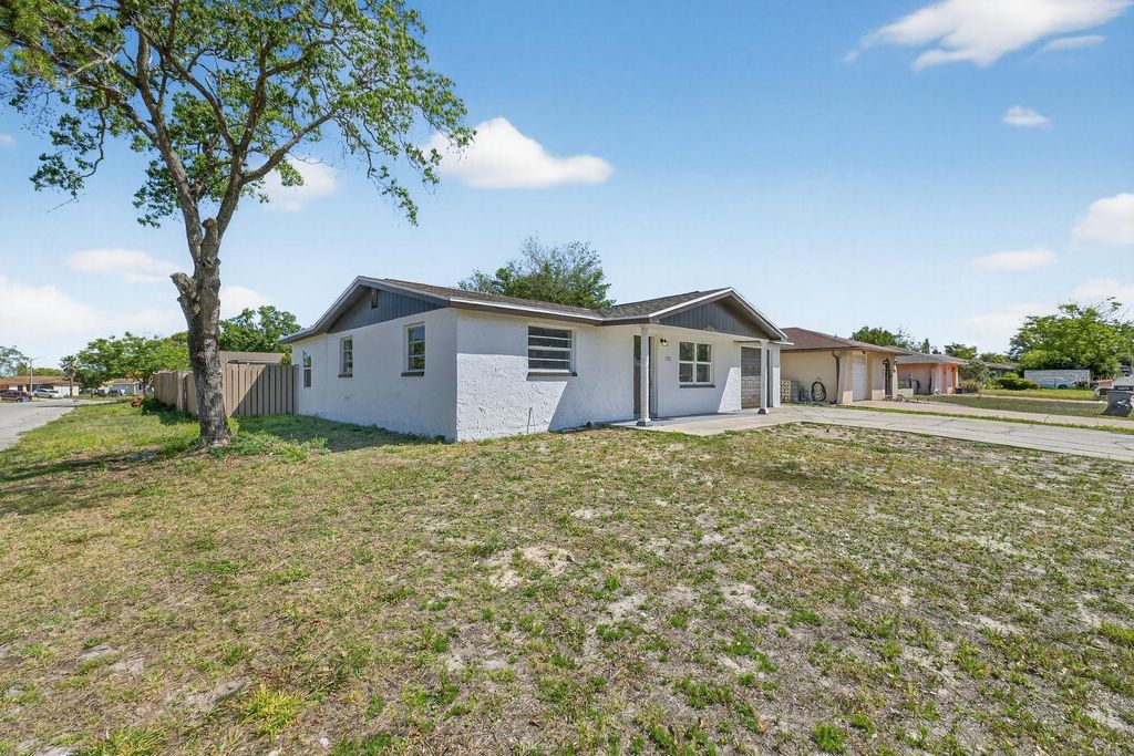 Photo of 7735 Brookridge Drive, Port Richey, FL 34668 (MLS # TB8494627)