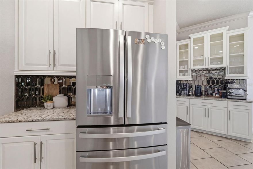 If you’ve been looking for a home with real space to spread out, entertain, and enjoy the Florida lifestyle, this one is worth seeing in person. Located in the highly sought-after Seven Oaks community of Wesley Chapel, this 6 bedroom, 4 bathroom home with nearly 3,400 square feet offers a layout that gives everyone room while still feeling connected in the main living spaces. From the moment you walk in, the home opens into bright living areas designed for both everyday life and entertaining. The kitchen flows naturally into the main living space, making it easy to host family gatherings, game nights, or holidays without feeling closed off from your guests. One of the standout features of this home is the dedicated indoor bar and entertainment space, creating the perfect spot for watching the game, hosting friends, or setting up your own private lounge area. It’s the kind of feature you rarely find in homes at this price point and it instantly becomes the social hub of the house. With six full bedrooms, the home offers incredible flexibility for larger families, multi-generational living, guest space, home offices, or even a private gym or hobby room. Step outside and you’ll find a covered lanai overlooking the oversized backyard, already plumbed for an outdoor kitchen, making it easy to create the backyard entertaining space most Florida homeowners dream about. The home is also a natural gas home, a feature buyers love for cooking, efficiency, and future upgrades. Beyond the home itself, Seven Oaks is one of Wesley Chapel’s premier master-planned communities. Residents enjoy resort-style amenities including multiple pools, a clubhouse, fitness center, tennis courts, playgrounds, scenic walking trails, and community events throughout the year. All of this sits just minutes from Wiregrass Mall, Tampa Premium Outlets, top-rated schools, restaurants, and major commuter routes. Homes with this much space, flexibility, and entertainment potential don’t come up often in Seven Oaks. If you’ve been waiting for something that gives you room to live, host, and grow, this is one you’ll want to experience in person.