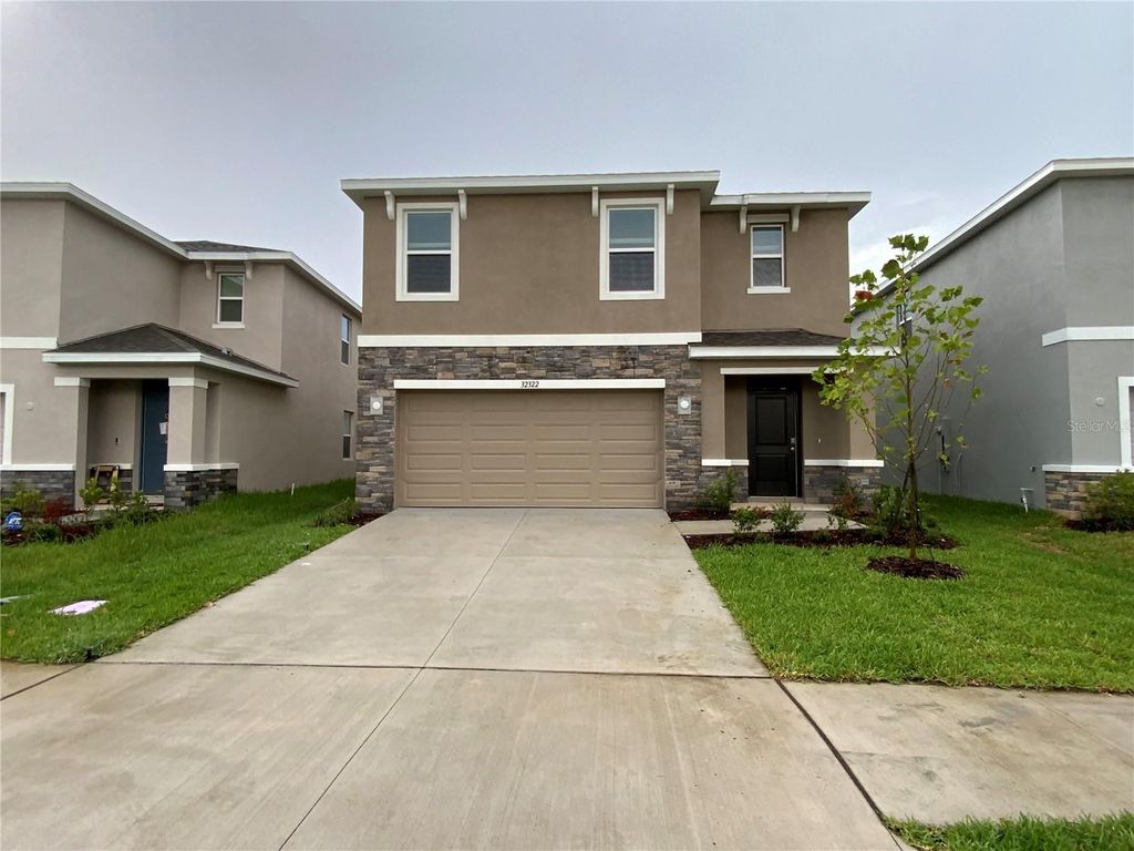 Photo of 32322 Evening Grove Ct, Wesley Chapel, FL 33543 (MLS # J1002673)