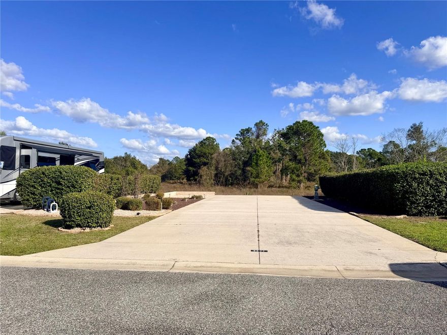 Welcome to Lot 241, a beautifully improved 5,076 sq ft back-in, west-facing property offering peaceful views and effortless outdoor living. This desirable location sits adjacent to open pasture, creating a serene backdrop where you can enjoy both gorgeous sunrises and unforgettable Florida sunsets.

The lot features a 26’ x 76’ concrete pad, providing ample space for your motorhome, tow vehicle, golf cart, and outdoor setup. Extensive improvements make this property immediately enjoyable, including thoughtful landscaping and a paver patio designed for relaxing, entertaining, and soaking up the Florida sunshine from day one.

Additional pavers along the pedestal side of the pad keep utilities clean, accessible, and easy to maintain—an often-overlooked upgrade that adds everyday convenience and polish.

Florida Grande is a sought-after Class A and Super C motorcoach resort known for its large deeded lots, wide streets, and peaceful country setting. Owners enjoy a welcoming, tight-knit community with beautifully maintained grounds, pickleball courts, clubhouse, pool, and regularly scheduled social activities. The resort’s central Florida location makes it an ideal home base for day trips, seasonal living, and year-round enjoyment, while still offering a quiet, uncrowded atmosphere that many RVers are actively seeking.

Lot 241 offers the perfect blend of views, upgrades, and location—a place to pull in, settle back, and truly enjoy the Florida Grande lifestyle.