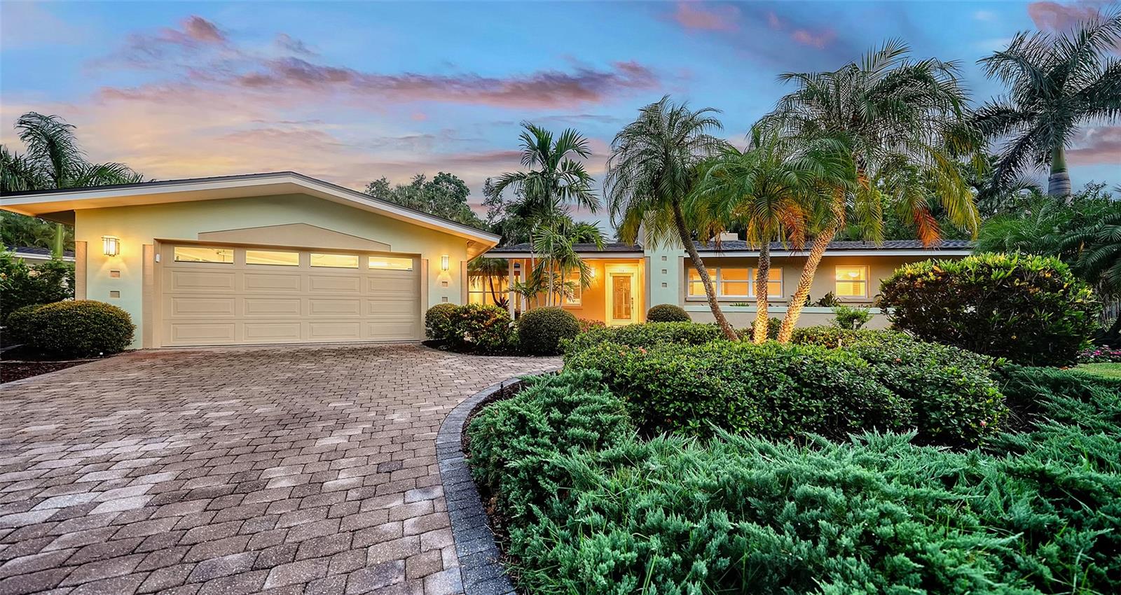 One or more photo(s) has been virtually staged. Move-in ready! This expansive 3 bedroom, 3 bathroom home with a heated pool & spa is nestled on a quiet cul-de-sac off Bay Shore Rd in the neighborhood of Indian Beach - Sapphire Shores. This european-style home offers a lot of natural light, a wall of French doors to the stunning lanai with a vaulted tongue-and-groove ceiling, overlooking the beautiful backyard and the heated pool & spa area. A bonus room with its own bath allows multiple use options, family room, home office, gym or another bedroom. Even the garage has been enlarged and offers space for a workshop and/or up to 2-3 cars. The roof was just replaced in 2025, the flooring is brand new and the primary bath is updated as well. Overall a well maintained property with a great curb appeal. Enjoy the lifestyle of this area with easy access to downtown Sarasota, dining, shopping and waterfront activities. Just 1 mile south of the Ringling Museum.