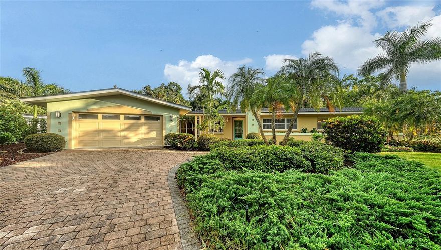 One or more photo(s) has been virtually staged. This expansive 3 bedroom, 3 bathroom home with a heated pool & spa is nestled on a quiet cul-de-sac off Bay Shore Rd in the neighborhood of Indian Beach - Sapphire Shores. This european-style home offers a lot of natural light, a wall of French doors to the stunning lanai with a vaulted tongue-and-groove ceiling, overlooking the beautiful backyard and the heated pool & spa area. A bonus room with its own bath allows multiple use options, family room, home office, gym or another bedroom. Even the garage has been enlarged and offers space for a workshop and/or up to 2-3 cars. The roof was just replaced in 2025, the flooring is brand new and the primary bath is updated as well. Overall a well maintained property with a great curb appeal. Enjoy the lifestyle of this area with easy access to downtown Sarasota, dining, shopping and waterfront activities. Just 1 mile south of the Ringling Museum.