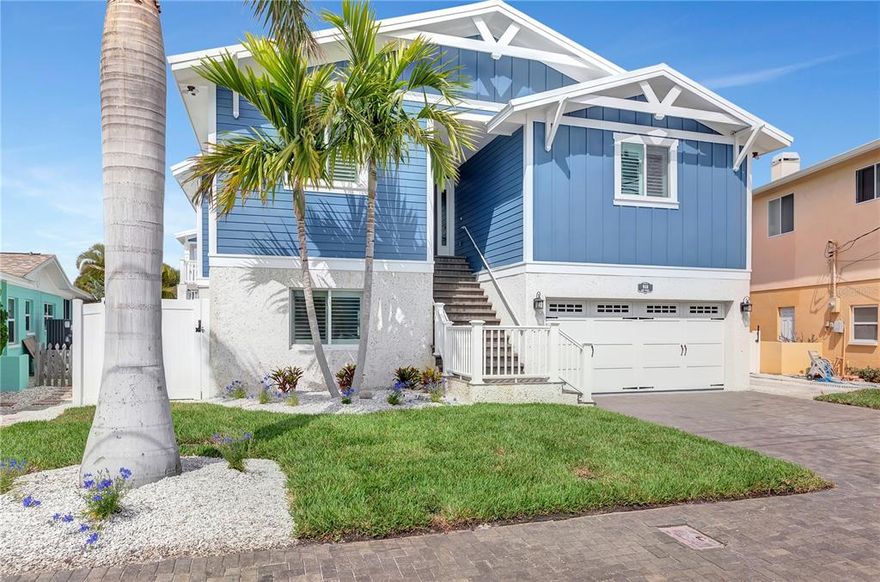 FLORIDA LIFESTYLE AT IT'S FINEST!!!   Don't miss this Key West inspired waterfront dream home.  A boaters paradise... just minutes to John's Pass and the open Gulf of Mexico.  You will be blown away by the views as you enter the home.  Enjoy watching the boats and dolphins go by and a daily sunset from the open concept 2nd story.  Soaring vaulted ceilings featuring tongue and grove accents open up the living space.   A wall of windows and 90 degree sliding doors means nothing is blocking your view.  The cook in your home will love the fully updated kitchen/ massive quartz island and walk in pantry.  The master bath is a dream come true with a massive walk in shower, free standing tub and his and her sinks.   The rear exterior proudly features a designer gas heated salt water pool, travertine pavers, massive dock, 20k lb boat lift, and a new seawall.  This lift will hold an obnoxiously large boat!   The home is an absolute masterpiece.  Fully renovated from top to bottom in 2016, the updates include METAL ROOF/ PLUMBING AND ELECTRIC/ SEAWALL/ CENTRAL AIR/ BOAT LIFT/ DOCK/ HEATED SALT WATER POOL/ ELEVATOR/ KITCHEN/ APPLIANCES INCLUDING AN INDUCTION COOKTOP/ BATHS/ REAL OAK HARD WOOD FLOORING/ PLANTATION SHUTTERS/ HURRICANE IMPACT WINDOWS AND DOOR/ POTERY BARN AND OTHER HIGH END FIXTURES/ GAS FIREPLACE WITH CUSTOM MATLEPIECE /IRRIGATION SYSTEM AND LANDSCAPING/ HARDI BOARD SIDING AND STUCCO/ SPRAY FOAM INSULATION ON ROOF DECKING AND BEHIND EXTERIOR WALLS.. The list goes on and on.   3 BEDROOMS AND 3 BATHSROOMS LOCATED ON THE 2ND FLOOR.   LOWER LEVEL IS GARAGE AND OPEN STORAGE.