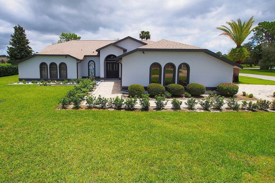 One or more photo(s) has been virtually staged. Welcome to this gorgeous and spacious 3 bedroom, 3 bathroom oasis nestled on a just-under ½ acre corner lot within a secure, private, and gated country club community. This thoughtfully designed home combines spaciousness with outstanding functionality and style. Enjoy the large, open living room with soaring ceilings and a cozy decorative fireplace. Triple ‘disappearing’ sliders lead directly to the covered 25x10 lanai. Throughout the rest of the house you'll find ceramic tile or polished hardwood laminate flooring. The master suite is a tranquil haven, featuring direct access to the lanai, dual closets and an ensuite bathroom with a garden tub, separate shower and a twin vanity with granite counters. Two additional bedrooms with walk-in closets and an updated guest bathroom provide plenty of space for family or guests. At the heart of this home is the screened outdoor patio, boasting a large 30x15’ heated pool and spa, a paver deck and a covered lanai with an outdoor kitchen ideal for the ultimate al-fresco living. A bonus pool shower bathroom keeps wet swimsuits out of the house! The entire home has been recently renovated including fresh paint inside and out, resurfaced pool, a new pool heater and pump,re-screened lanai, new carpet in the living room, upgraded lighting and upgraded landscaping. Phew! Located in the prestigious Glen Lakes subdivision, you’ll have access to a wide array of fantastic amenities including *18-Hole championship golf course *full service pro-shop *Aqua-driving range *35,000 Sq Ft clubhouse with 2 restaurants and bar *6 clay tennis courts *4 pickleball courts *Junior Olympic-size pool *Fitness center equipped with modern top-tier gear *an active social program. You may never want to leave! Note: Social membership is optional and additional fees will apply. Multiple services are included with the monthly rent: Yard care, pool care, TruGreen lawn services, internet access and basic cable (Spectrum), and trash pickup. You just pay for water, electric and any propane used to heat the pool. Don't miss this opportunity to enjoythe best of the Florida lifestyle in a beautiful home with incredible amenities. Contact us today to schedule a viewing. Several photos have been virtually staged to illustrate potential furniture layouts.