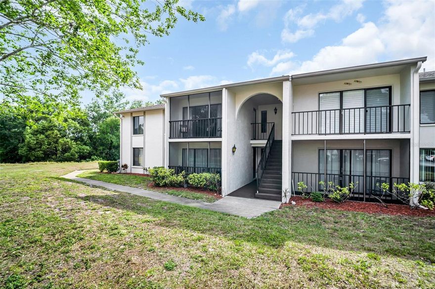 Private and beautifully updated condo in Palm Harbor’s highly desirable 55+ pet-friendly Pine Ridge community! This gorgeous 2-bedroom, 2-bath END UNIT offers modern upgrades, abundant natural light, peaceful green nature views, and a highly functional layout. The stunning kitchen features an open design overlooking the main living area, gorgeous granite countertops, newer cabinetry, sleek stainless appliances, subway tile backsplash, and plenty of storage and prep space. Waterproof luxury vinyl plank flooring flows throughout the home for a clean, cohesive look. The spacious living room opens through sliding glass doors to a screened-in lanai, creating the perfect place to relax and enjoy Florida living. The large primary suite includes an oversized closet and an en-suite bathroom with walk-in shower, while the guest bedroom is conveniently located near the second full bathroom, making it ideal for visitors or a home office setup. A large indoor laundry room adds extra convenience! Residents enjoy low monthly condo fees and exceptional community amenities, including a large heated Olympic-style swimming pool, scenic walking trail around the lake and fountain, clubhouse with social activities, and beautifully maintained grounds. Monthly condo fees include the community pool, escrow reserves fund, exterior maintenance, grounds maintenance, onsite management, pool maintenance, sewer, trash, water, basic cable, and internet. This pet-friendly community is ideally located safely in a NON-FLOOD ZONE just minutes from shopping, restaurants, parks, and Gulf beaches. Don't wait - schedule your private showing today!