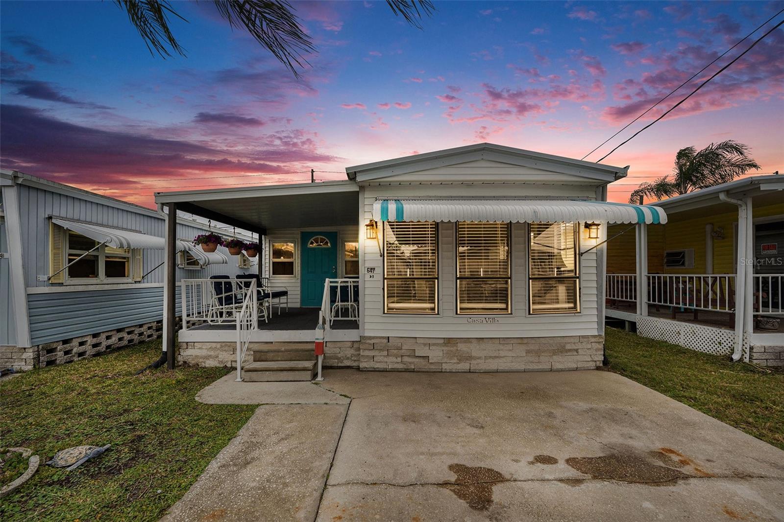 Welcome to this charming two-bedroom, one-bathroom manufactured home in the desirable 55+ community of Crystal Bay in Palm Harbor! This home offers the perfect combination of comfort and style, ideal for enjoying the Florida lifestyle. Step inside to discover new wood-look laminate flooring throughout, creating a fresh, modern feel. The living room and kitchen seamlessly blend in an open-concept design, with tons of windows bringing in natural light, making the space feel light and bright. The kitchen boasts matching appliances and a skylight, filling the room with even more sunshine and adding a touch of warmth. Both nicely sized bedrooms offer ample space and comfort, while the bathroom is conveniently located nearby. This property features brand-new electrical throughout, ensuring safety and efficiency. While it did experience flood damage from Hurricane Helene, it has been fully remediated, providing a secure and refreshed living space. Step out onto your inviting front porch to enjoy your morning coffee or relax with a good book. There's also a back deck perfect for outdoor entertaining or just soaking in the sunshine while you enjoy the beautiful Florida weather. This home is located in a golf cart-friendly community with fantastic amenities such as a clubhouse, pool, shuffleboard courts, and private docks. The community also features its own private boat ramp, making it easy to enjoy boating and water activities. If you prefer, the Sutherland Boat Ramp is just a short drive away, providing direct access to the Gulf. Conveniently located near Downtown Palm Harbor, you'll have access to local dining options, shopping, and more. The Pinellas Trail is nearby for walking, biking, or golf cart rides, and you'll be just minutes from the stunning Florida coastline. Don't miss out on this incredible opportunity to own a beautiful home in Crystal Bay. Contact us today for more details or to schedule a showing!