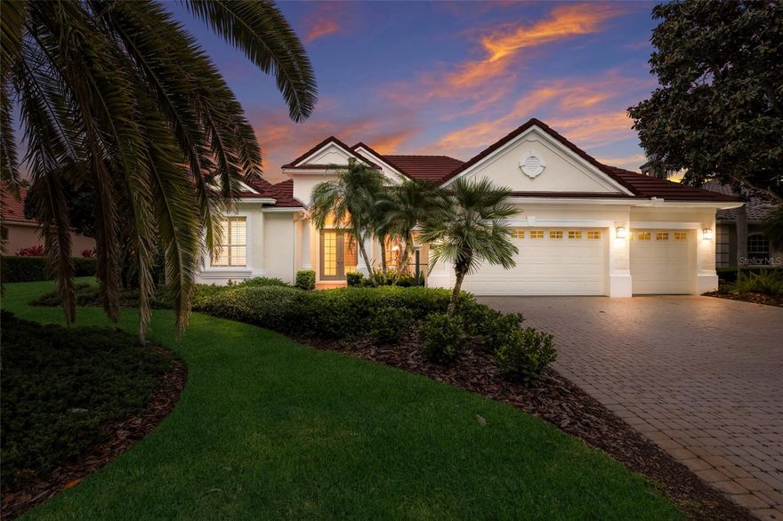 This beautiful residence in the sought-after Country Club at Lakewood Ranch, built by Lee Wetherington, offers over 2,900 square feet of refined living with breathtaking full water views.  Featuring three spacious bedrooms and three full baths, including a den and office.  The luxurious primary suite with serene water vistas, 2 large walk-in closets, dual sinks, separate shower and outdoor shower that blends comfort, quality, and elegance.  Designed for seamless indoor-outdoor living, sliding pocket doors open to a stunning lanai with a heated pool and spa, showcasing a new pool surface and tile.  The outdoor kitchen is perfect for entertaining, while a gas fireplace adds warmth and charm to the living space.  Recent upgrades include a new roof and two new A/C systems providing peace of mind for years to come.  Additional highlights include a three-car garage, & freshly painted interior.  Beautifully positioned with expansive water views in one of Lakewood Ranch's most desirable communities, offering optional memberships that provide access to four golf courses, three restaurants, and pickleball and tennis courts.  The Country Club is centrally situated near fine dining and shopping at Waterside Place and UTC, with convenient access to both Sarasota and Tampa airports, and just a short drive from some of the nation's most beautiful beaches.