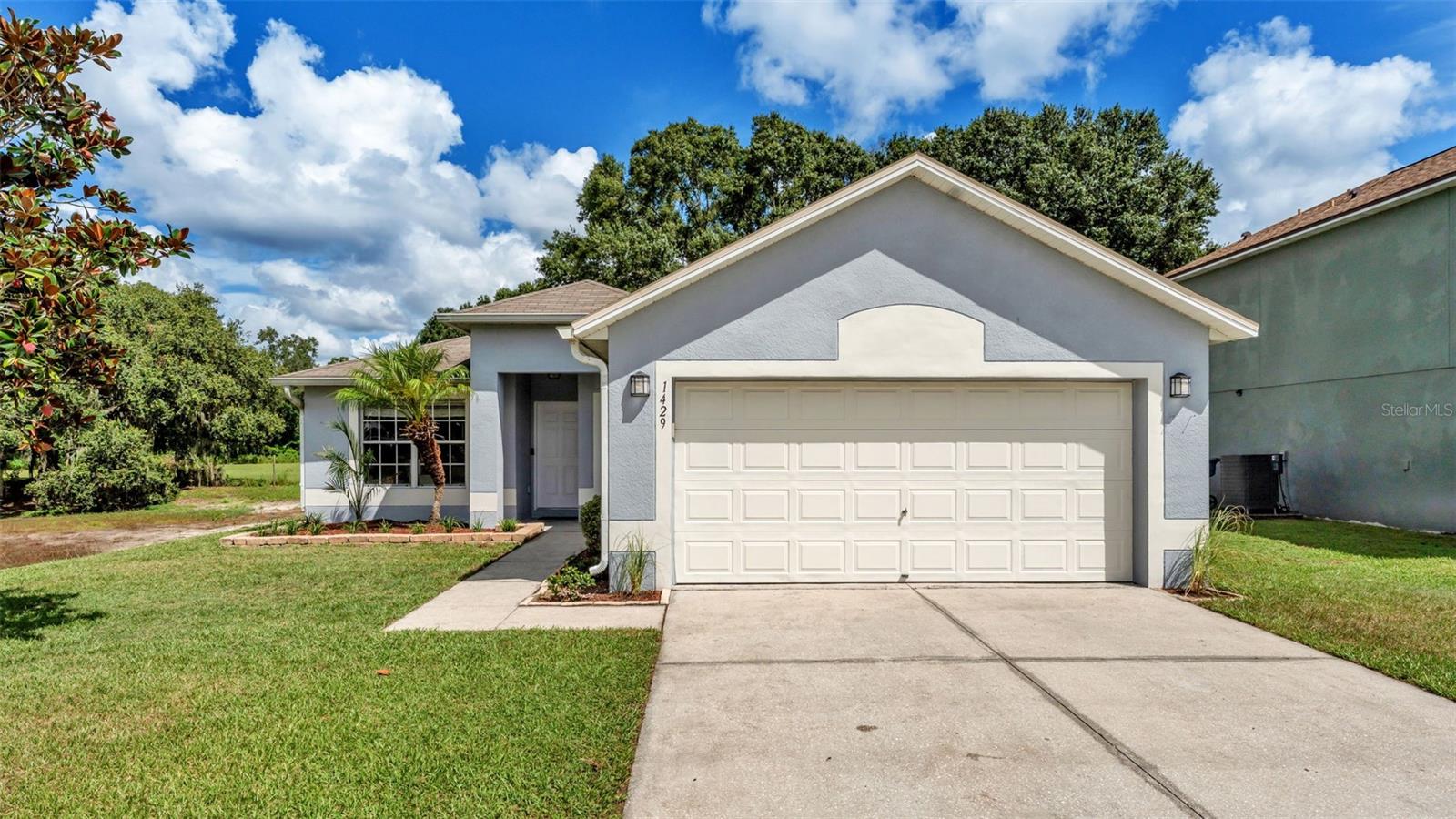 Step inside this light and bright home featuring a spacious great room with vaulted ceilings and a desirable split bedroom floor plan. The kitchen is equipped with granite countertops, stainless steel appliances, and a functional layout that opens to the main living area.
Beautiful wood-look tile flooring runs throughout main areas, creating both style and easy care. Enjoy Florida living on the screened-in patio overlooking the large, fenced backyard, plenty of space for relaxing or entertaining. Additional highlights include an indoor laundry area with washer and dryer included. Brand NEW A/C in 2025 and roof was replaced in 2015. This property combines thoughtful upgrades with a convenient Lakeland location. Schedule your showing today!