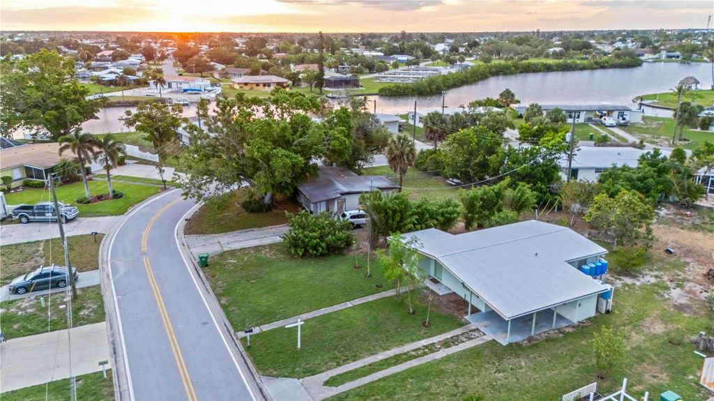 Photo of 180 Palmetto Circle NE, Port Charlotte, FL 33952 (MLS # C7511661)