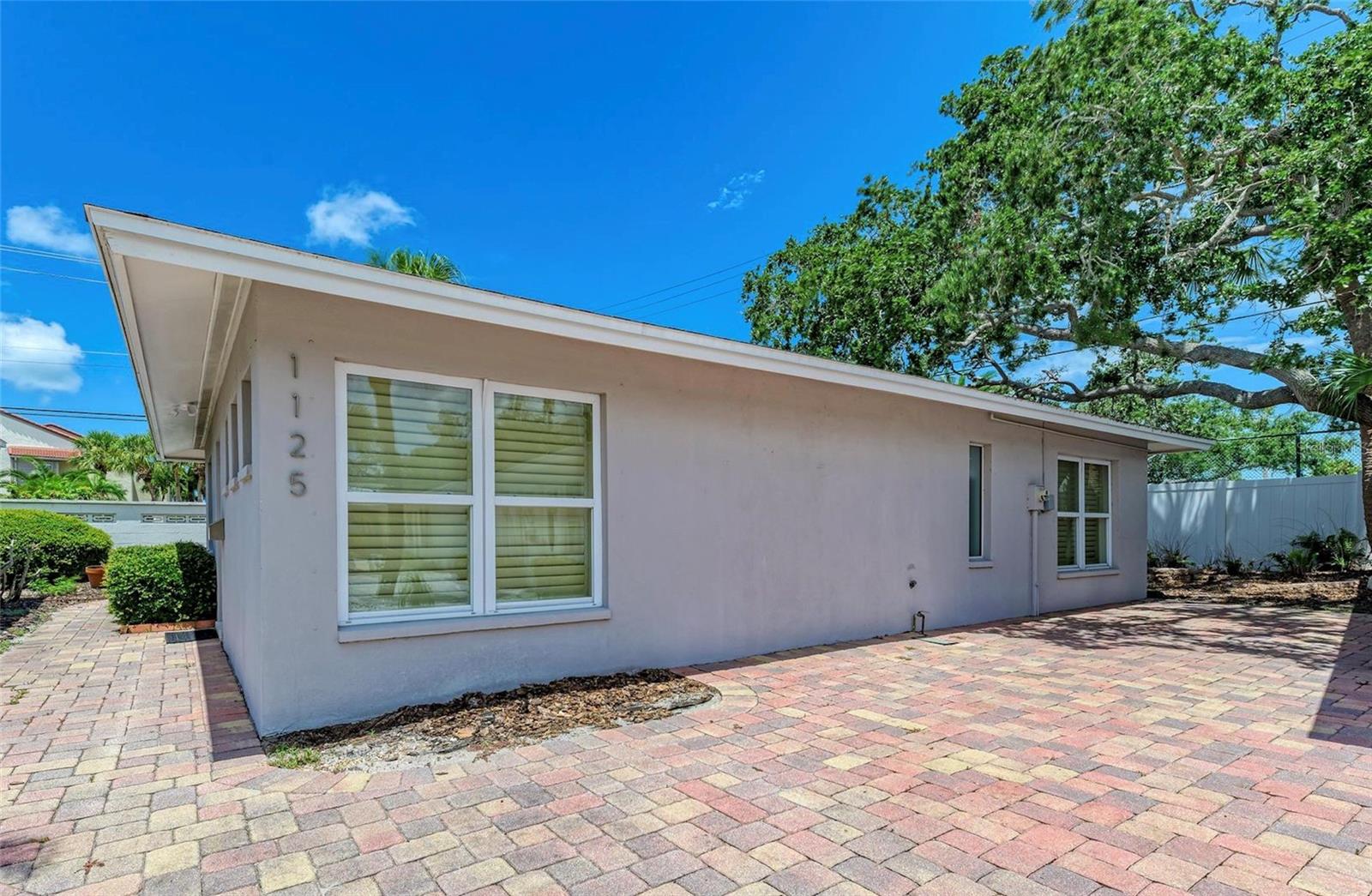 Welcome to your dream retreat! This delightful 2-bedroom, 1.5-bathroom furnished villa is nestled in the sought-after Polynesian Gardens community on beautiful Siesta Key. Just a 12-minute walk to the pristine sands of Crescent Beach, this home offers the perfect blend of relaxation and convenience.
This villa has been completely remodeled after sustaining hurricane damage, ensuring it's better than ever. Updates include new flooring, refinished and repainted cabinets, updated countertops, and new drywall, giving the home a fresh, modern feel.
Step inside and be greeted by an open and airy living space, complemented by modern updates throughout. The kitchen boasts sleek stainless steel appliances, making meal preparation a pleasure. The spacious master bedroom features private access to a stunning outdoor patio that spans the length of the home—ideal for morning coffee or evening cocktails. The second bedroom provides ample space for guests or a home office. The updated full bathroom adds a touch of luxury with a soaking tub and rain shower, as well as dual sinks. Enjoy dinner al fresco on the patio with a table for four and BBQ grill.
Outside, the Polynesian Gardens community offers a wealth of amenities, including a heated swimming pool for year-round enjoyment, a vibrant community clubhouse with regular social events, and a fishing pier perfect for a relaxing afternoon by the water. World-famous Siesta Key beach and Village are just a short ride away, either by bike or the complimentary Frog Hop trolley.
Whether you're seeking a full-time residence, a seasonal getaway, or a rental to add to your portfolio, this villa is a true gem. Don't miss your chance to own a piece of paradise in Polynesian Gardens, Siesta Key!