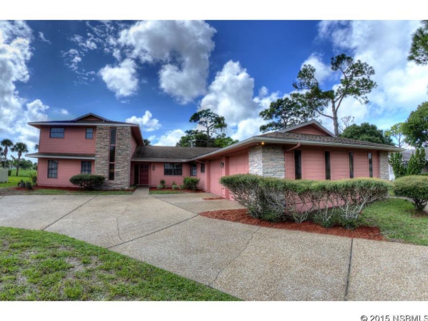 MOTIVATED SELLER SAYS BRING OFFER!  Executive home awaits the golfing family who loves to entertain!  You will love to entertain in awesome great room that features authentic, rare pecky cypress, stone fireplace and indoor gas grill next to it ... BBQ in A/C comfort! Super Bowl party will be a hit, as you serve your guests from sunken bar featuring refrigerated keg, ice maker and all the trappings, including copper top bar with leather arm rest. Two master suites, large eat-in kitchen and spacious laundry room.  Large master bath has separate tub and shower areas, each with its own commode.  Oversized garage, with twin 10 foot wide doors, nice depth and workshop area. Circular drive on 100 ft lot that fronts on municipal golf course, and your views go all the way to Wayne Avenue and not one neighbor behind you! Room for swimming pool, or join the heated, Fairgreen community pool by optional membership. Municipal Golf Course at your back door, or walk across the street and play a second round at Hidden Lakes Golf Course. Exterior freshly painted Aug 2015. Large eat-in kitchen has hard surface counters, some newer appliances, kitchen island and breakfast area larger than most dining rooms. Electric drapes on south walls, sun tunnels, double pane windows, and many other features make this a special family home. Great, central location, close to everything, short drive to beach. Located in popular Fairgreen Golf Community, but no H.O.A dues or restrictions, allowing you to fence your yard, and not need approvals normally seen with a Homeowner Association.  Lots to like in this spacious home that is ready for the golfer and family who enjoy entertaining. Offered As Is, inspections welcomed.   Measurements are approximate. ;Water: City