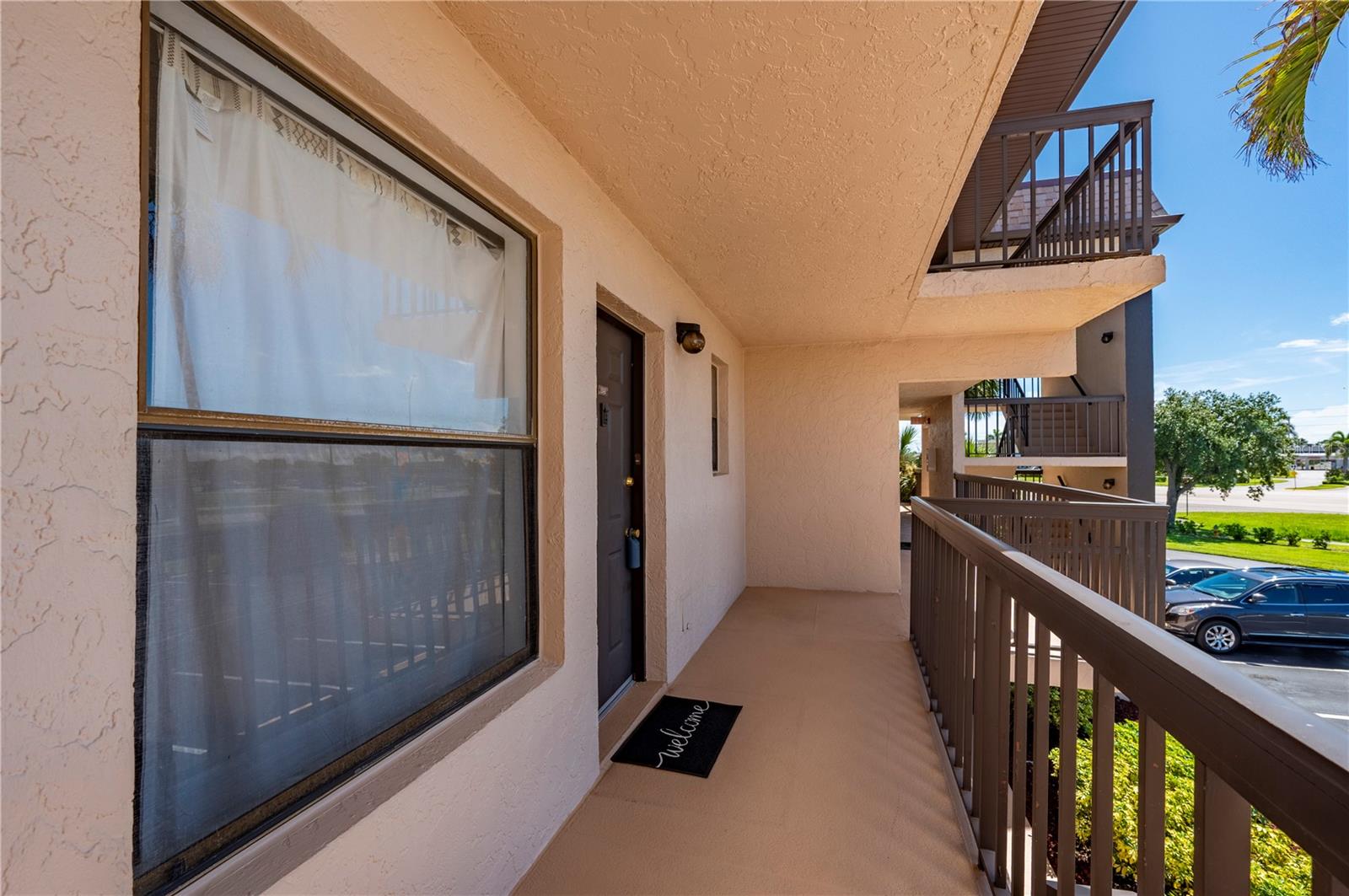 Here is an amazing opportunity to own a 2-bedroom, 1-bathroom second-floor condo located in an up-and-coming area of Port Charlotte! Nestled in the active, 55+ community of Sandhill Pines, this move-in ready unit offers the perfect blend of value and potential. Featuring an open-concept floorplan with a spacious combination living and dining area, this unit is clean, functional, and ready for your personal touch. Unit is situated close to the elevator, and Sandhill Pines is not in a flood zone. Enjoy peace of mind with recently updated roofs on all buildings, as well as maintenance-free living with included exterior upkeep: lighting, landscaping, and pest control. Relax in the sparkling pool, gather with friends and family at the clubhouse, work out in the fitness room, or get some friends together and enjoy the outdoor grill and covered picnic area. Sandhill Pines features a quiet winding sidewalk, lush native vegetation, and a tranquil lake—perfect for morning walks or evening strolls. Take your morning coffee on your private, screened lanai and enjoy a view of the lake and the tennis court. Sandhill Pines is ideally-situated near modern shopping plazas featuring an array of shopping and dining opportunities, county recreational parks and sports fields, and beautiful Gulf Coast beaches. Enjoy downtown Punta Gorda, the Sunseeker Resort, and easy access to I-75 for commuters. Whether you're looking for a full-time residence, seasonal escape, or future investment property, this condo offers incredible value in a prime location.
