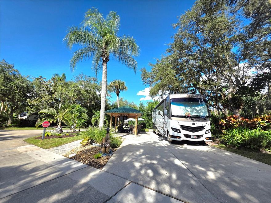 Welcome to your perfect getaway spot in the highly desirable Phase 2 of River Ranch RV Resort! This beautifully landscaped corner lot (with common ground buffer — neighbors only on one side!) offers the ideal combination of privacy, style, and resort living.
Custom-Built Cypress Pavilion- Durable cypress construction with elegant pine tongue-and-groove ceiling set on a pavered pad
Comes fully equipped with: Bar stools, Grill, Dining table & chairs, Ceiling fans & lighting, Mounted television
Golf cart parking space, Picnic table with two umbrellas
Just minutes from Phase 3 & 4 pools, showers, restrooms, and laundry facilities
BONUS Package Deal INCLUDES an Electric Golf Cart.  RV not included in sale
Whether you're looking for a weekend escape or a seasonal retreat, this turn-key lot is ready for you to roll in and relax. Don’t miss this rare corner lot opportunity with premium features in one of the most sought-after resort phases. ***Wine Barrel does not convey***