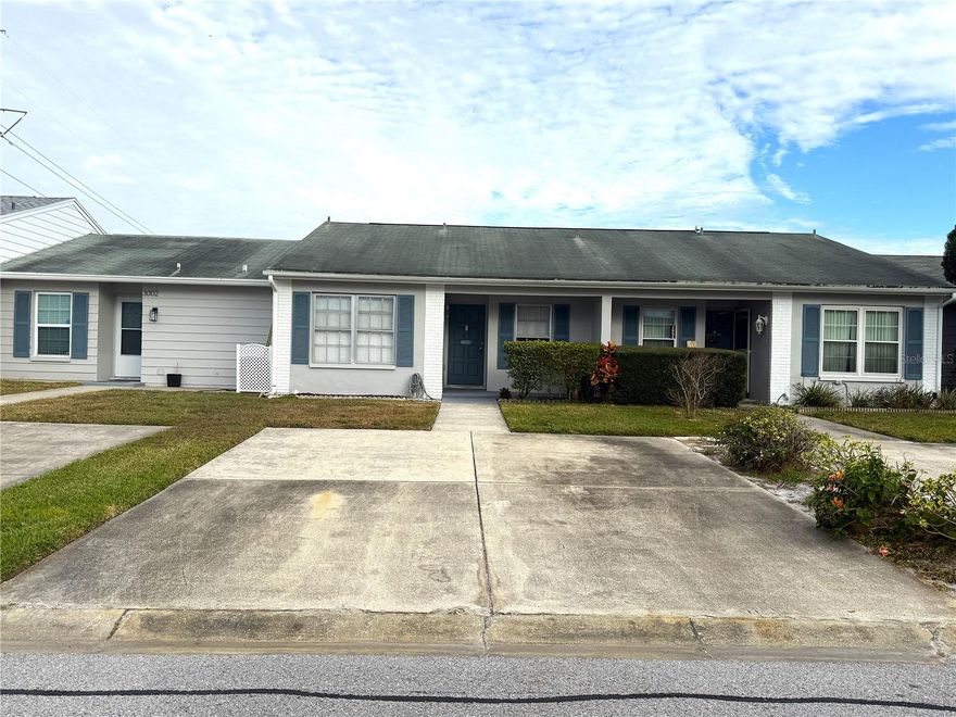 Welcome to this cozy and well-maintained villa located in the desirable Veterans Villas community in the heart of New Port Richey. This charming home offers 2 comfortable bedrooms and 1 full bathroom, making it an ideal choice for small families, couples, or anyone seeking low-maintenance living. Enjoy the inviting enclosed lanai, perfect for relaxing or taking in the Florida breeze, and appreciate the convenience of a spacious walk-in closet in one of the bedrooms. While there is no garage, the property includes two dedicated parking spots directly in front of the home for easy access. With its warm layout and prime location near shopping, dining, and local amenities, this villa offers both comfort and convenience. both comfort and convenience.