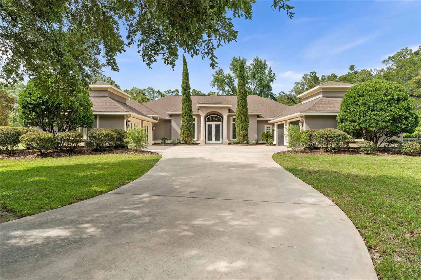 Welcome to your dream property — a beautifully crafted 4-bedroom, 3-bathroom home offering luxurious living, equestrian amenities, and serene privacy on over 5 acres of land. Located in an exclusive gated community, Wyndsong Manor, this estate is perfect for those seeking a refined lifestyle with modern conveniences.
Step inside to find hand-scraped hardwood floors throughout, an expansive open-concept layout, and a grand fireplace that anchors the spacious living area. The chef’s kitchen is ideal for entertaining, featuring a large center island, high-end appliances, and ample storage.
Work from home in style with a generously sized private office or even turn it into an air conditioned indoor gym. The home also includes an oversized 2-car garage with plenty of room.
Outdoor living shines with a sparkling pool and a large covered patio — perfect for summer gatherings or simply quiet evenings.
Equestrian lovers will appreciate the enclosed barn complete with its own bathroom and air conditioned flex room upstairs, oversized storage room, half basketball court, two horse stalls, a wash rack, tack rack, and two newly fenced paddocks.
This rare offering combines upscale amenities, spacious living, and an unbeatable setting and privacy, as well as two new AC units added in 2020 as well as the beautiful hand-scraped hardwood floors installed in 2020.
Don’t miss your chance to own a piece of paradise!