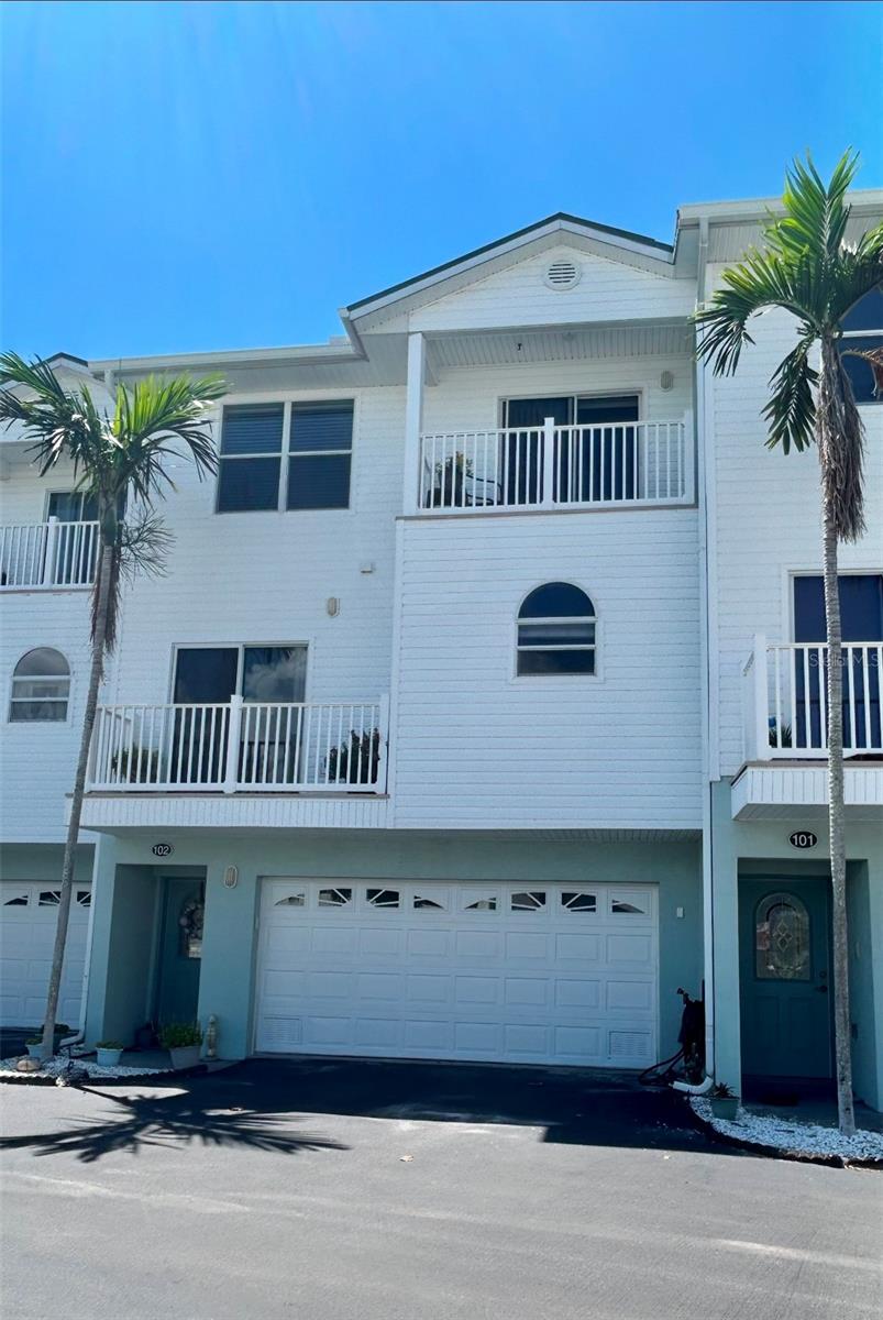 Priced to Sell! Want beach living?! Must see this Beautiful home right across the street from one of the most gorgeous gulf beaches of Pinellas County! Gulf views from the very large Master Bedroom. As you enter from the FOUR CAR GARAGE, that also has a storage closet, you will enter into a lovely foyer. Once up the stairs onto the main living space, you will enter into an expansive open floor plan with hardwood floors throughout the large living, dining and bonus room/den areas. The kitchen is equipped with newer appliances and granite countertops. The kitchen has ample space and cabinet storage! Head up to the third floor where you will find the 3 bedrooms, including an oversized primary with a walk in closet. Don't want to use the stairs? No worries, the home has its very own PRIVATE ELEVATOR inside! which makes unloading groceries a breeze! Each floor has 2 balconies (4 total). Newer AC (2020). Luxury living at its finest, close to a lot of dining options and shopping. Schedule for your showing today! Buyer/Agent to verify all dimensions and HOA info.