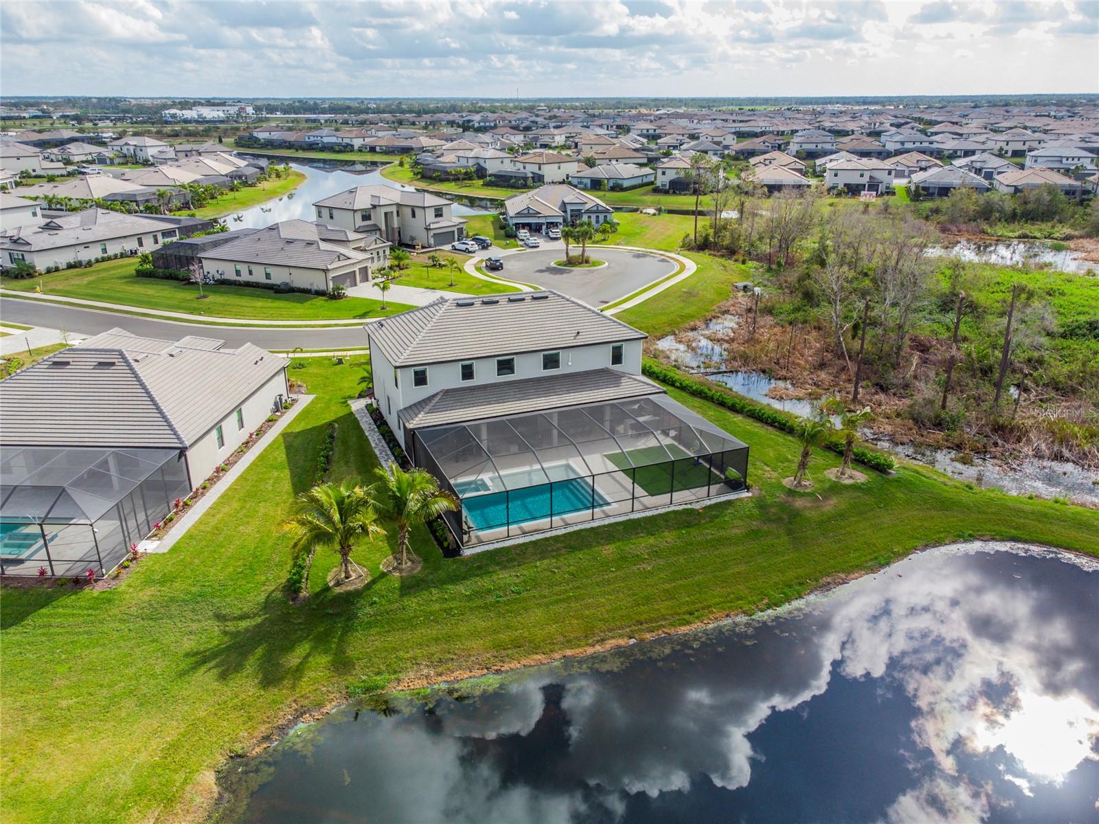 A newly customized home where luxury meets modern day style is for rent in the highly desired community of Lorraine Lakes in Lakewood Ranch. The lease includes Cable TV, Internet, lawn care, pool maintenance and access to the club house. This 5 bedrooms, 4.5 bathrooms, den and office is just a little over a year old. This gem is located on a cul-de-sac on a semi-private lot next to the preserve overlooking the pond in the rear. The house’s interior is 100% customized. The floors are tile throughout the entirety of the home. Upon entering this beauty, you encounter a 22’ high open foyer leading into the great room with a design made of natural stone. The kitchen overlooks the open great room with an 8-burner gas cooktop, wine cooler, soft closing ceiling height, natural wood cabinet doors and drawers, with an extensive amount of pantry space and a touchscreen refrigerator with views to the lanai and pond. Off the kitchen there is a half bathroom and a laundry room. To the right of the great room you’ll have a second master bedroom with sliding doors, walk-in closet, and full bath equipped with double sink and walk-in shower. The stair railing leading to the upper floor are of glass giving it an open space feel. The upstairs has laundry room for convenience. To the right you have the first master bedroom with 3 walk-in closets, and a double shower with bench and his and hers sinks. There are 3 additional bedrooms with built in closets and 2 full baths. The house has Hunter Douglas motorized window treatments throughout. The exterior has a customized outdoor kitchen with sink, BBQ, cooktop and a mini fridge. The 60’ wide spacious lanai is ideal for entertainment and overlooks the salted custom-made pool, spa with color changing lights and heater. The house includes a water filtration system and a separate filtration for the sprinklers. The amenity center offers a restaurant, pickle ball court, tennis court, basketball indoor and outdoor, gym, 2 pools, splash pad for kids and a playground.