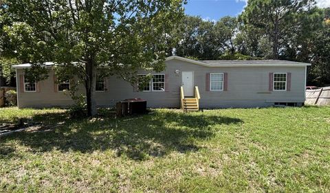 Photo of 151 West Loop, Oak Hill, FL 32759 (MLS # NS1085659)
