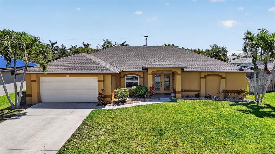 Welcome to your private slice of paradise in the highly sought-after Pelican neighborhood of SW Cape Coral! This beautifully maintained 3 bedroom + den, 2 bath pool home offers the perfect blend of comfort, convenience, and Florida lifestyle living. Step outside and unwind in your sparkling screened-in pool with a relaxing jacuzzi hot tub—perfect for enjoying peaceful evenings under the covered lanai. The lush, mature landscaping featuring triplet palms, banana and mango trees, and areca palms creates a serene, private backyard oasis. Inside, you’re greeted by soaring vaulted ceilings and a bright, open-concept layout filled with natural light. The spacious kitchen overlooks the pool and backyard—making everyday living feel like a retreat. The great room and den/office are especially light and airy, ideal for both relaxation and productivity. Enjoy peace of mind with a newer roof (2023), impact windows 2024 and a whole-house water filtration system. Peace of mind knowing home never flooded. Located just minutes to the walkable Cape Harbour and Tarpon Point Marinas, waterfront dining, shops, and the popular Surfside area with its weekly farmers market. Plus, quick access to Veterans Pkwy makes trips to Fort Myers or Punta Gorda a breeze!