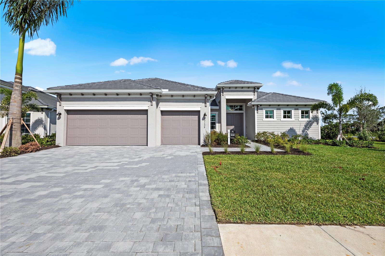THIS HOME IS READY FOR YOU NOW!! The three bedroom, three bathroom Sunset estate home delivers an airy, open floor plan ideal for
entertaining. Enter through a formal foyer into an expansive great room with glass sliders leading to the spacious lanai. The kitchen with large island is every cook’s dream and marries the living space and formal dining room. This split-plan features an owner's suite retreat with two walk-in closets, dual sinks, standing shower and private entry to the lanai. On the other end of the home, an additional two bedrooms each boast their own full bath and ample storage. The home is complete with a cozy den, ideal for the home office or library. At 2,650-square-feet, The Sunset is the perfect place to grow your family. Additional options in home include quartz countertops, porcelain tile throughout, upgraded cabinetry and appliance package. Renderings, photos & virtual tour are of like model and are used for display purposes only.