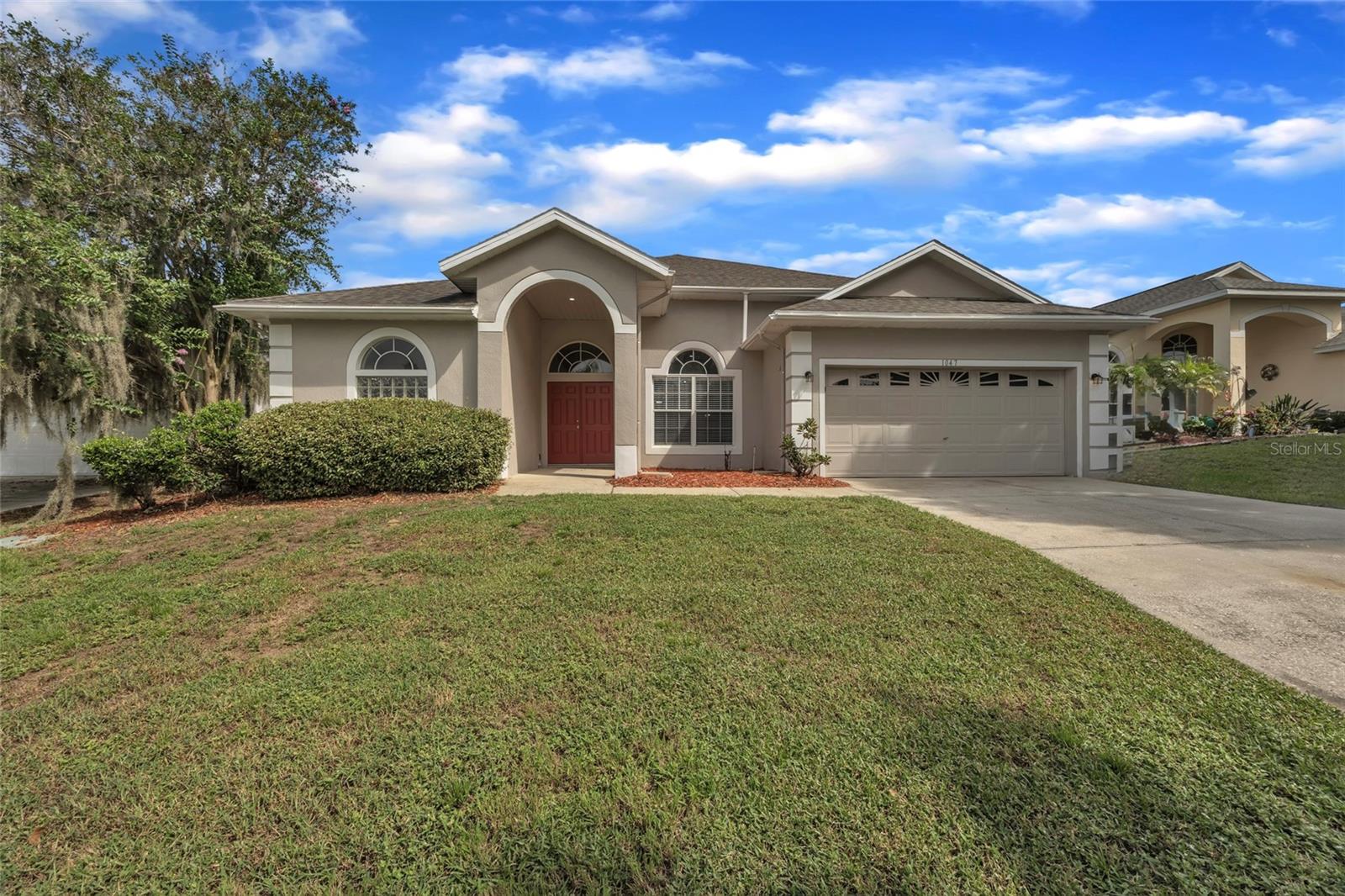 One or more photo(s) has been virtually staged. Welcome to your dream home in the heart of Davenport! This spacious 5-bedroom, 3-bathroom pool home offers the perfect blend of comfort, functionality, and Florida lifestyle. Located in a serene community with golf course views, this property features an open floor plan with high ceilings, tile flooring throughout the main living areas, and plenty of natural light. The updated kitchen features ample cabinetry, quartz countertops, and stainless steel appliances, overlooking a large living and dining area that’s perfect for entertaining. The split-bedroom layout includes a spacious primary suite with pool access, dual vanities, a soaking tub, and walk-in shower. Step outside to your private screen-enclosed pool and covered patio, perfect for relaxing or hosting family and friends. The home also includes a 2-car garage, indoor laundry room, and fresh neutral paint throughout. Enjoy peaceful views, a generous backyard, and proximity to shopping, dining, and major attractions. Whether you’re looking for a primary residence, vacation home, or investment property—this one checks all the boxes!